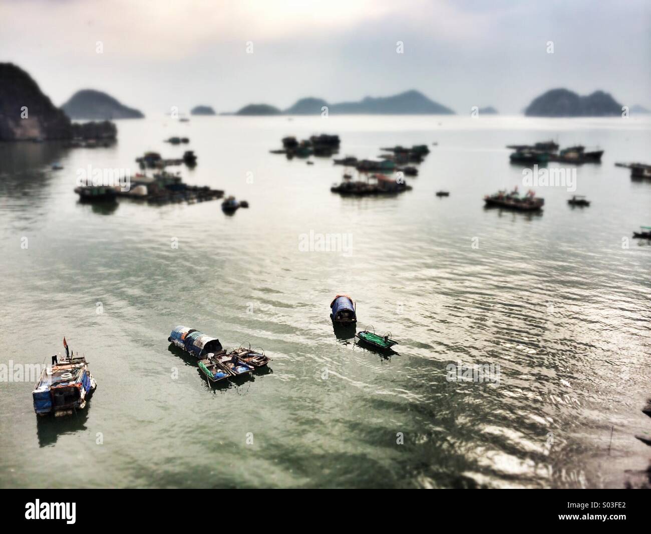 Fishing boats near the island of Cat Ba in Ha Long Bay - Smartphone Captured Stock Image