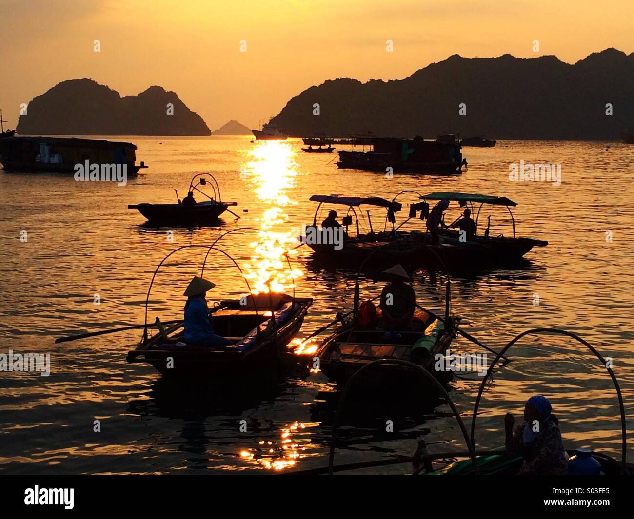 Fishing boats near the island of Cat Ba in Ha Long Bay - Smartphone Captured Stock Image