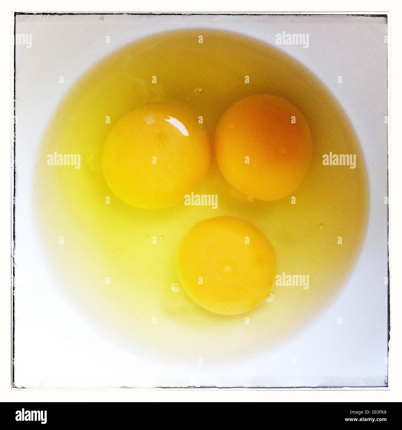Three eggs in a white bowl - Smartphone Captured Stock Image