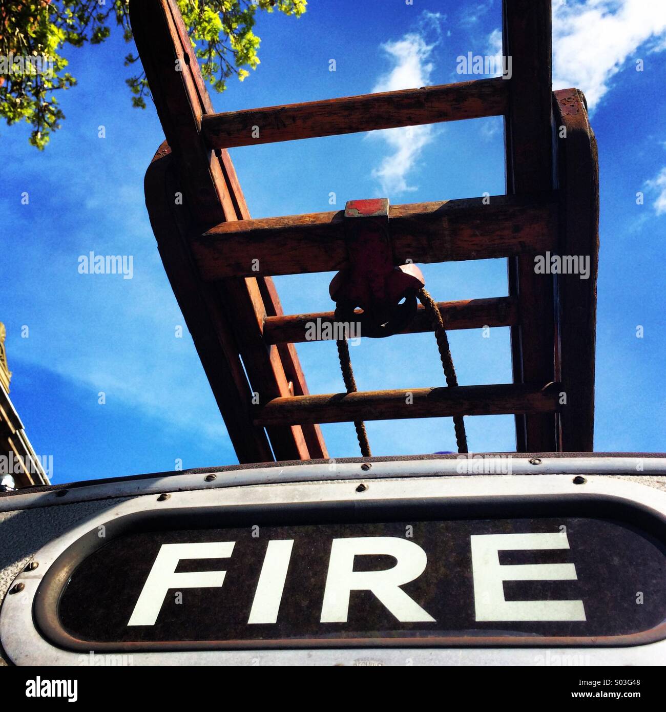 Close-up of a 1950's Fire Engine roof sign and mounted ladder. - Smartphone Captured Stock Image