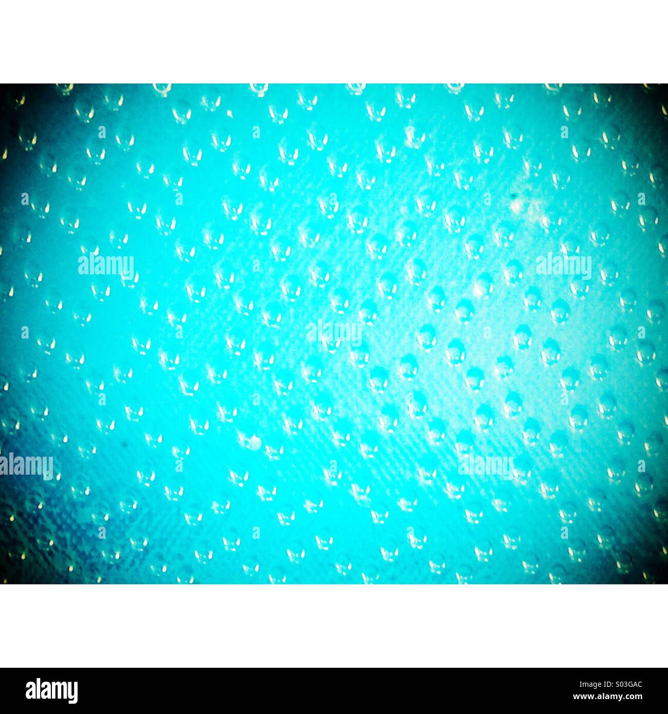 1960's retro frosted patterned glass in kitchen unit - Smartphone Captured Stock Image