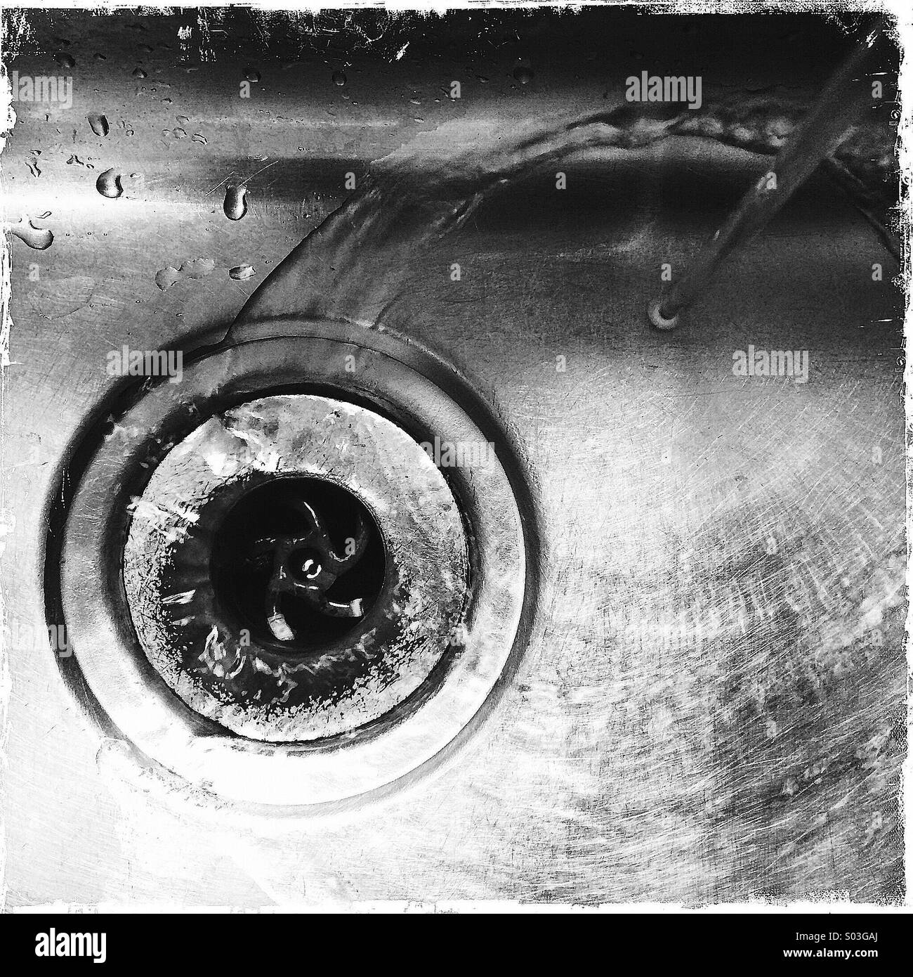 Water running into 1970's stainless steel sink - Smartphone Captured Stock Image