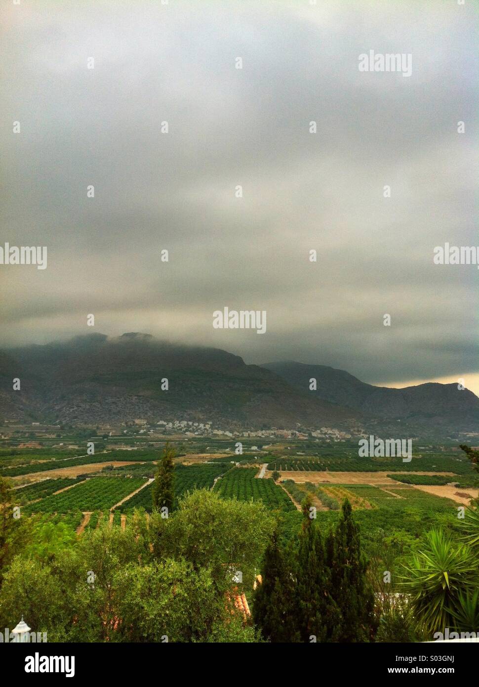 Storm clouds gather over the mountains near Orba, Spain Stock Photo