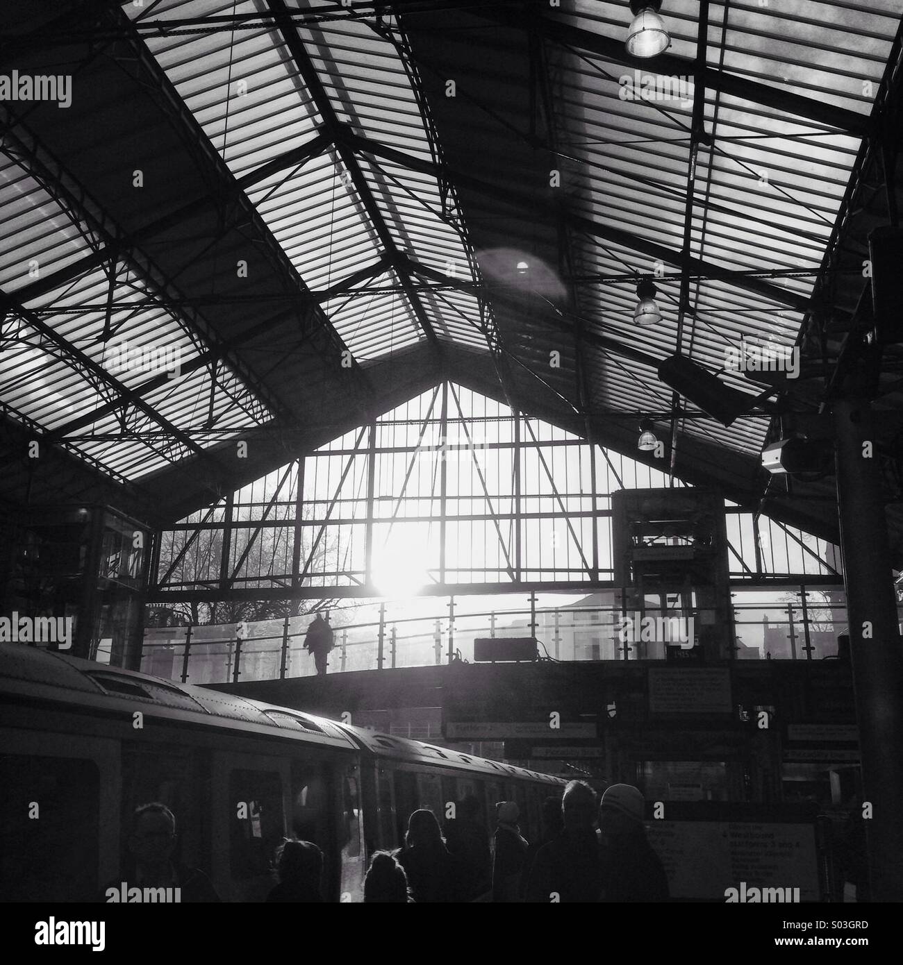 Sunshine and silhouettes at Earl's Court Underground station, London, UK. Stock Photo