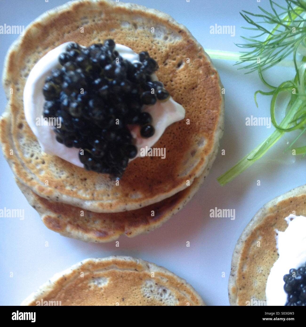 Blini with caviar and Creme fraiche Stock Photo