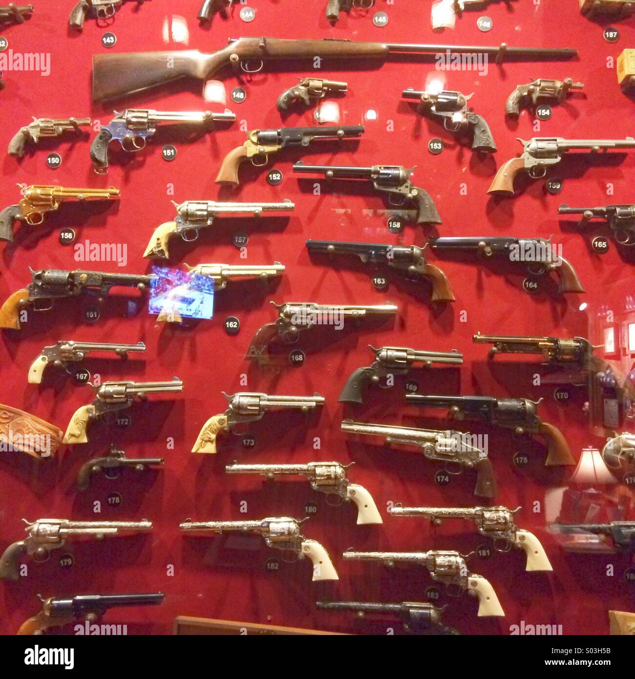 Guns in display case - Smartphone Captured Stock Image