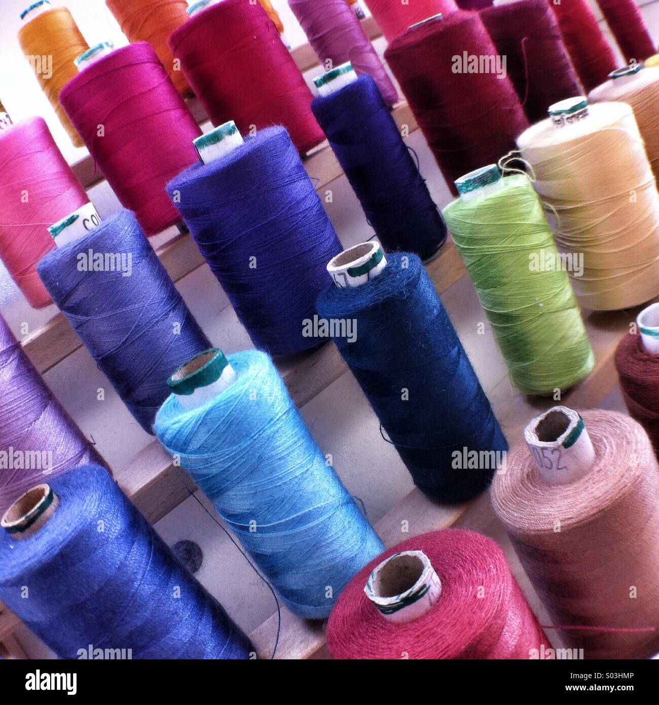 Cotton reels on a rack - Smartphone Captured Stock Image