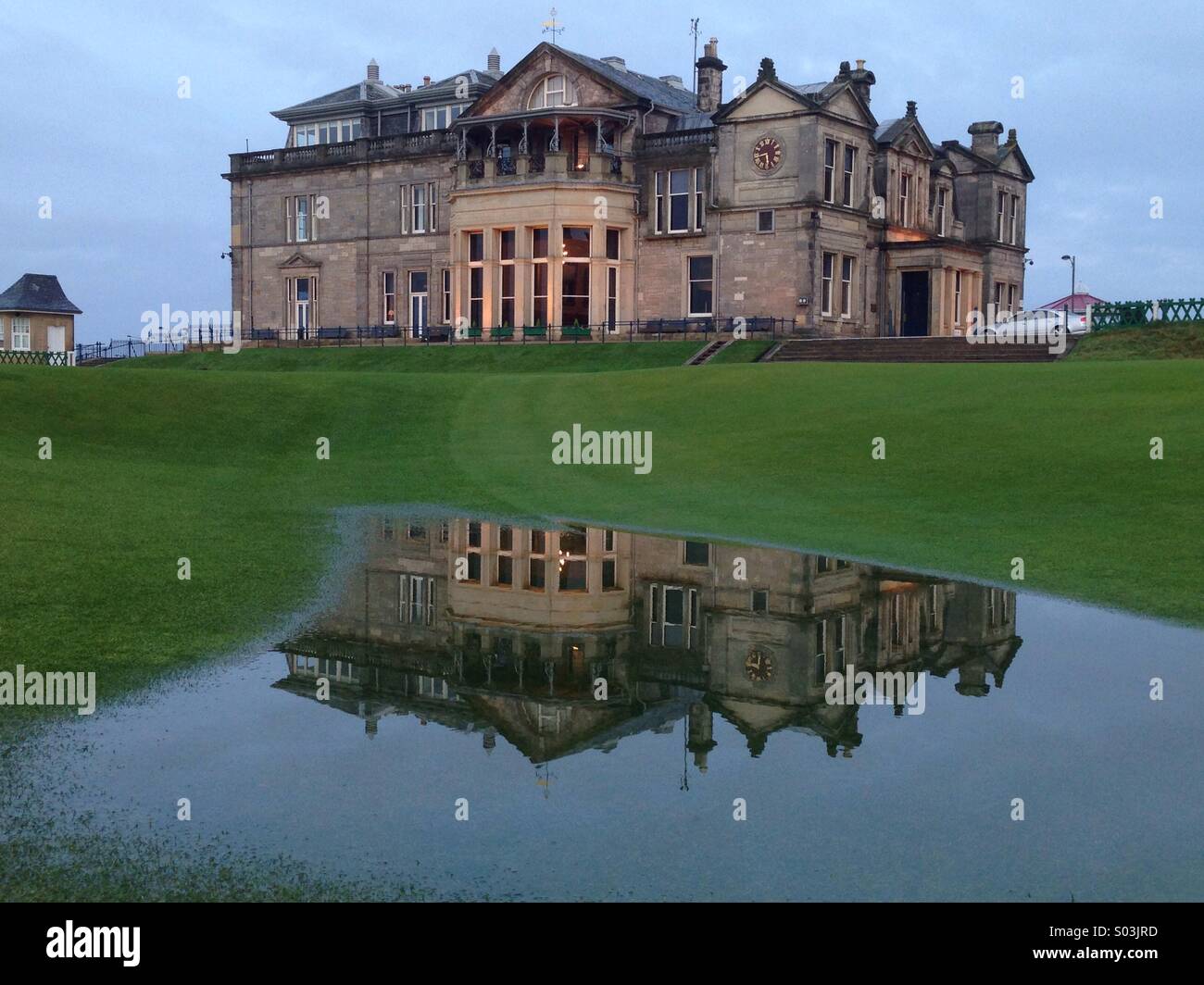 Clubhouse of the Royal and Ancient Golf Club of St Andrews feflected in  temporary water on the 18 th fairway of The Old Course Stock Photo - Alamy
