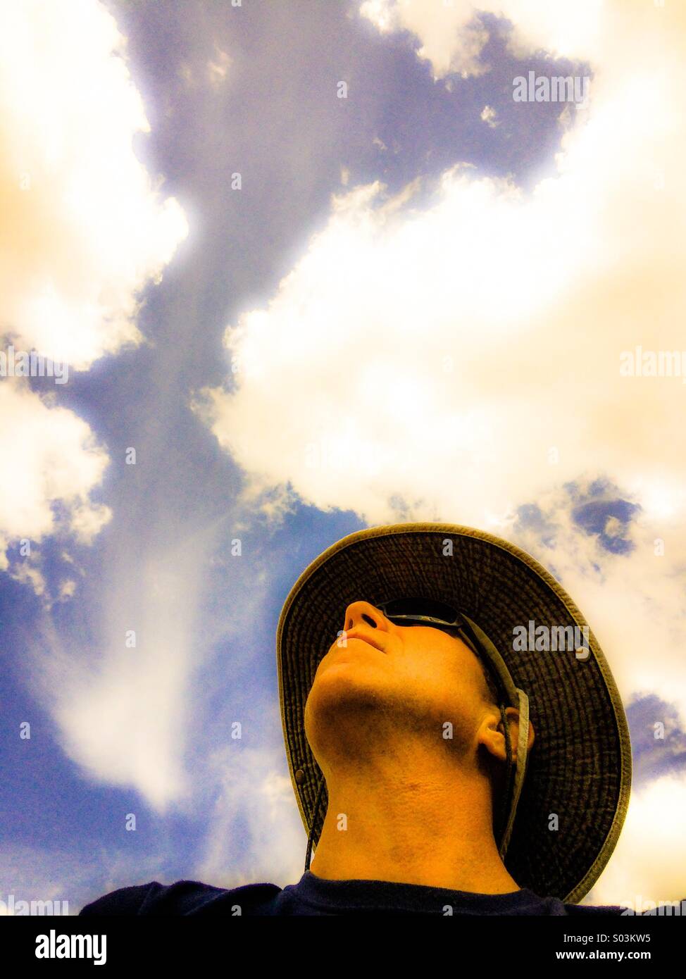Man looking up into the sky - Smartphone Captured Stock Image