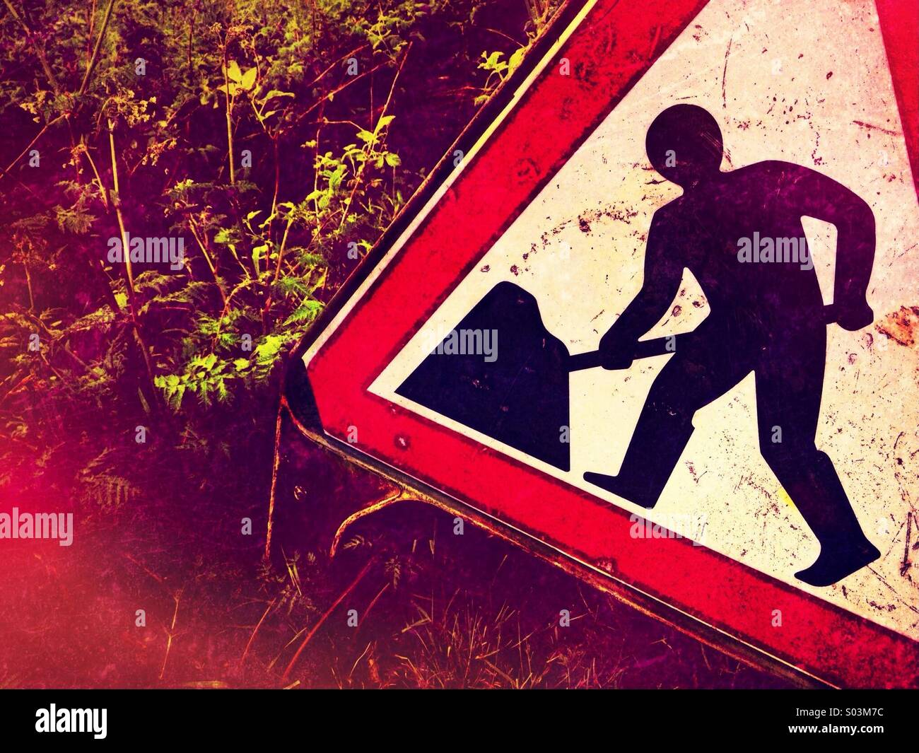 Working men warning sign in field - Smartphone Captured Stock Image