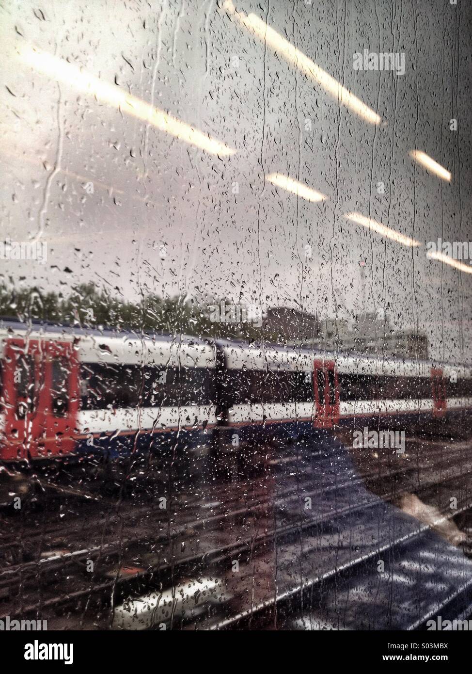 Train through a rainy window - Smartphone Captured Stock Image