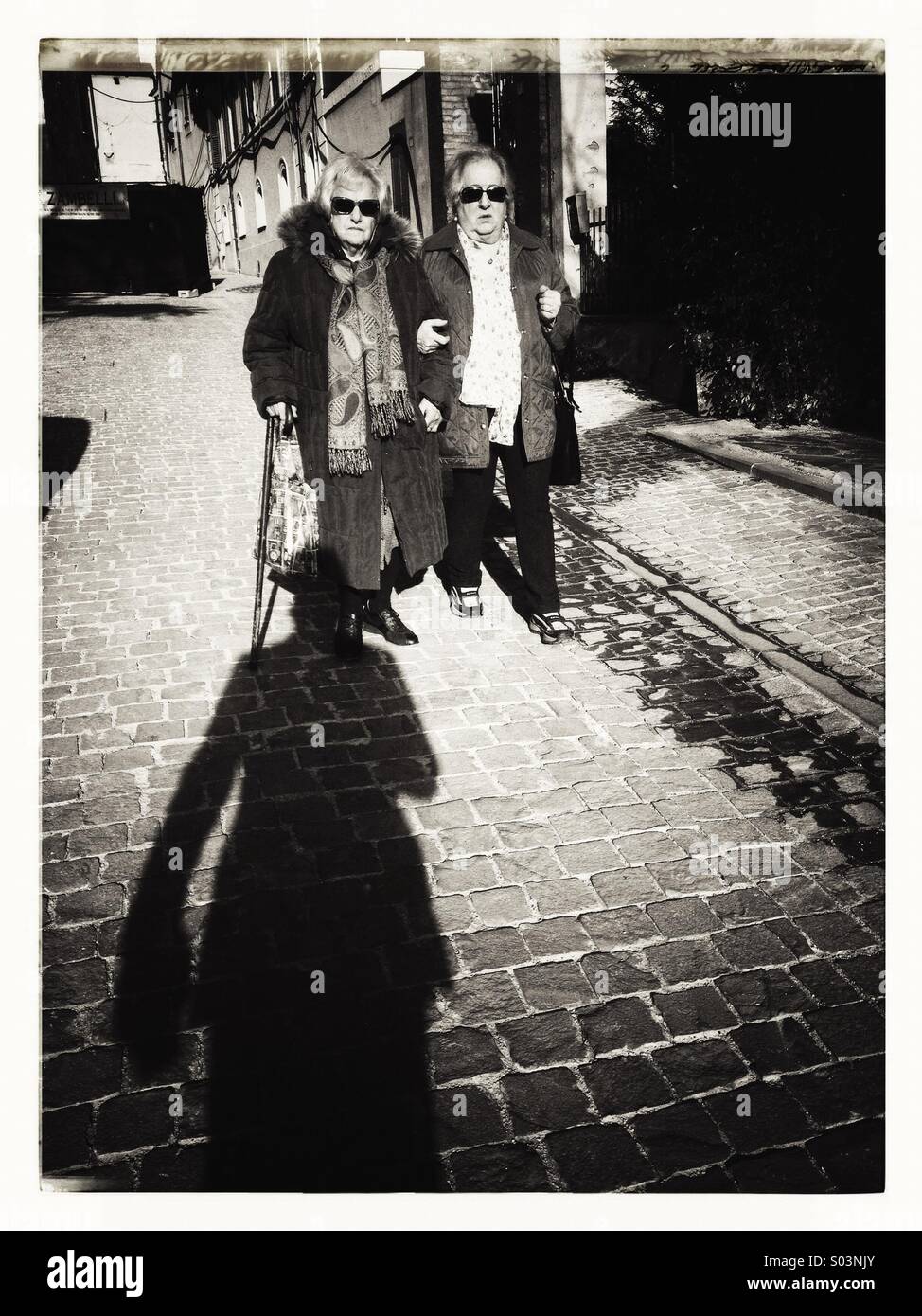 Two elderly women walking on the street - Smartphone Captured Stock Image