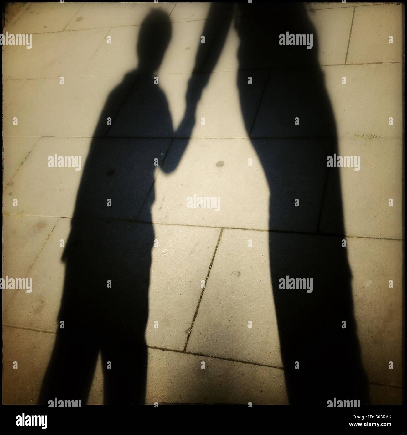 Mathor Shadow Shadow of a mother and her son Stock Photo - Alamy