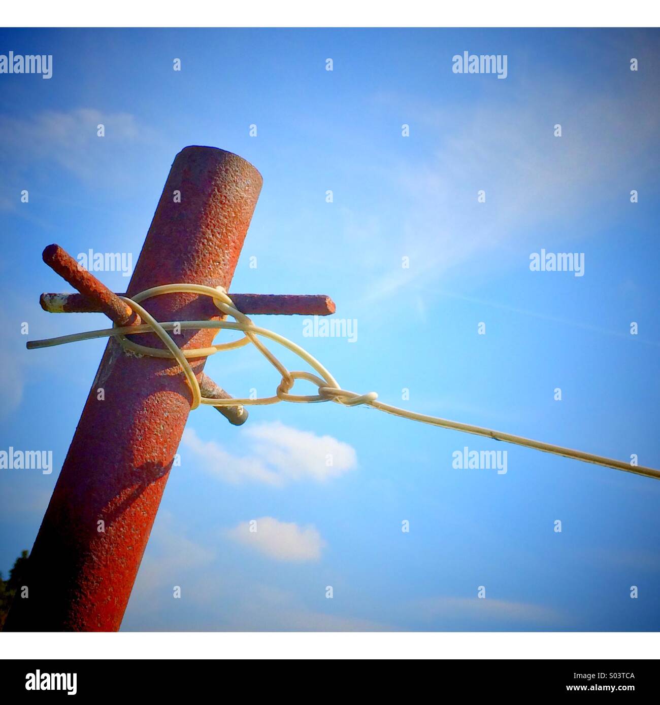 Rusted metal pole with washing line attached - Smartphone Captured Stock Image