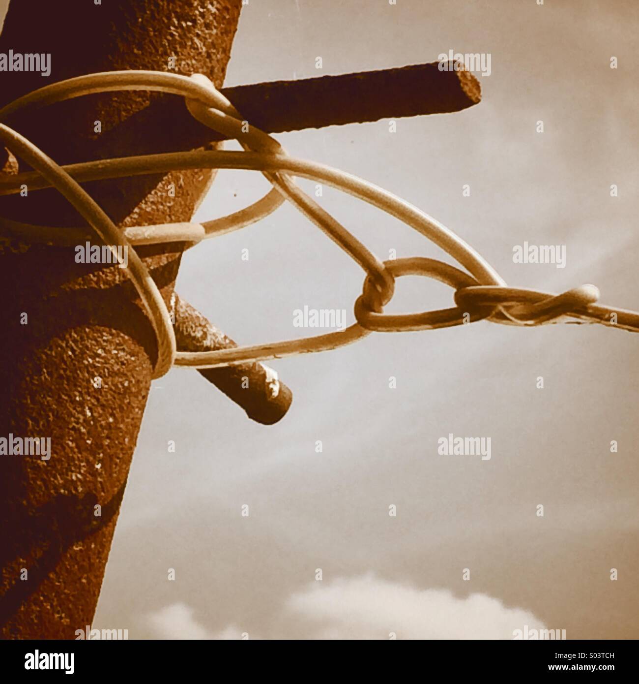Rusted pole with washing line tied on it - Smartphone Captured Stock Image