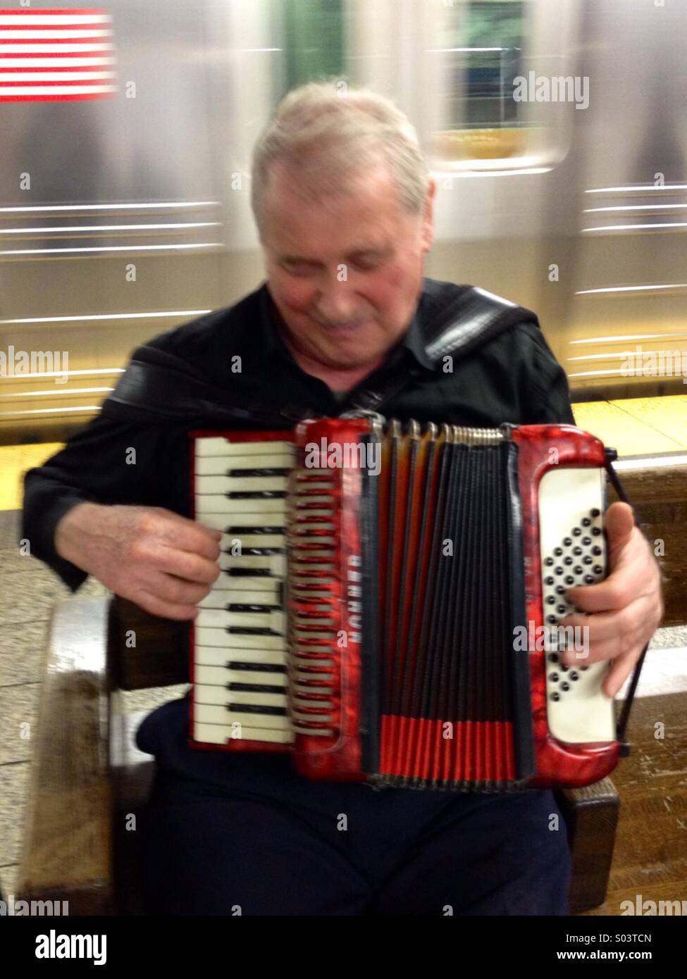 Accordionist in the New York subway. Stock Photo