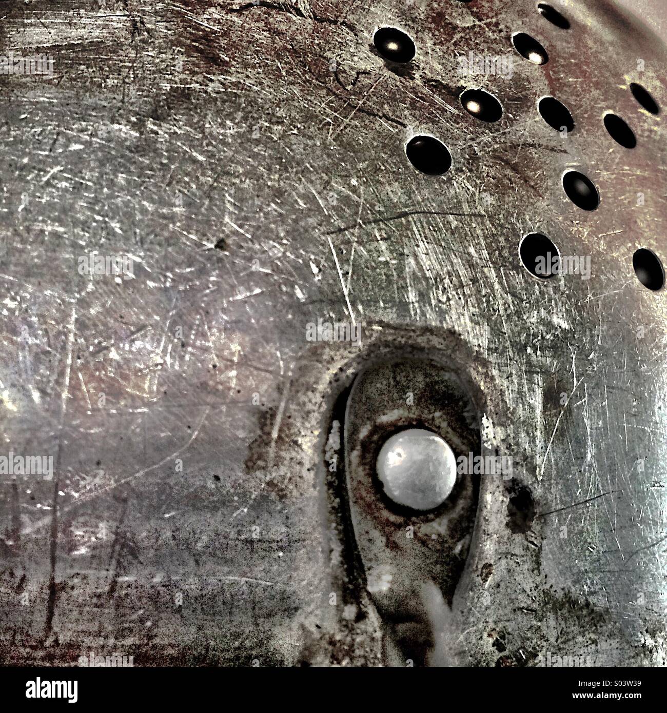 Close up of scratched old metal colander - Smartphone Captured Stock Image