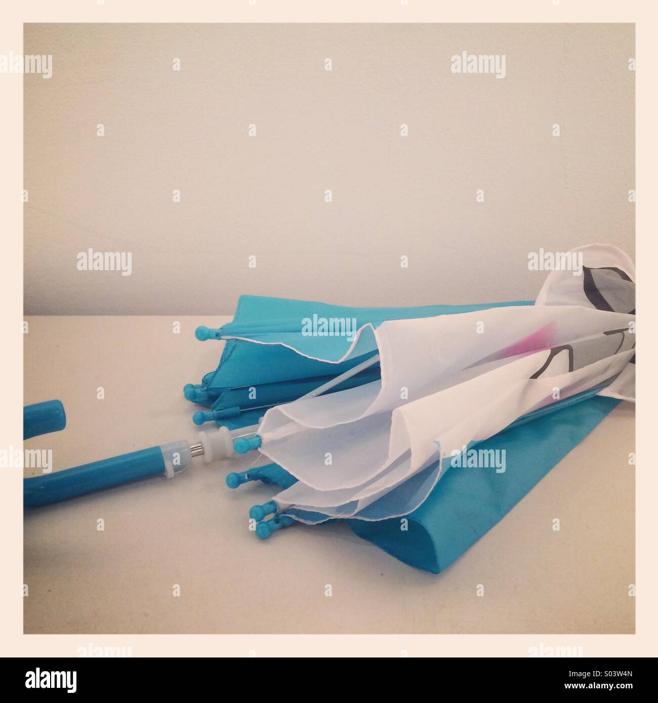 A blue and white umbrella - Smartphone Captured Stock Image