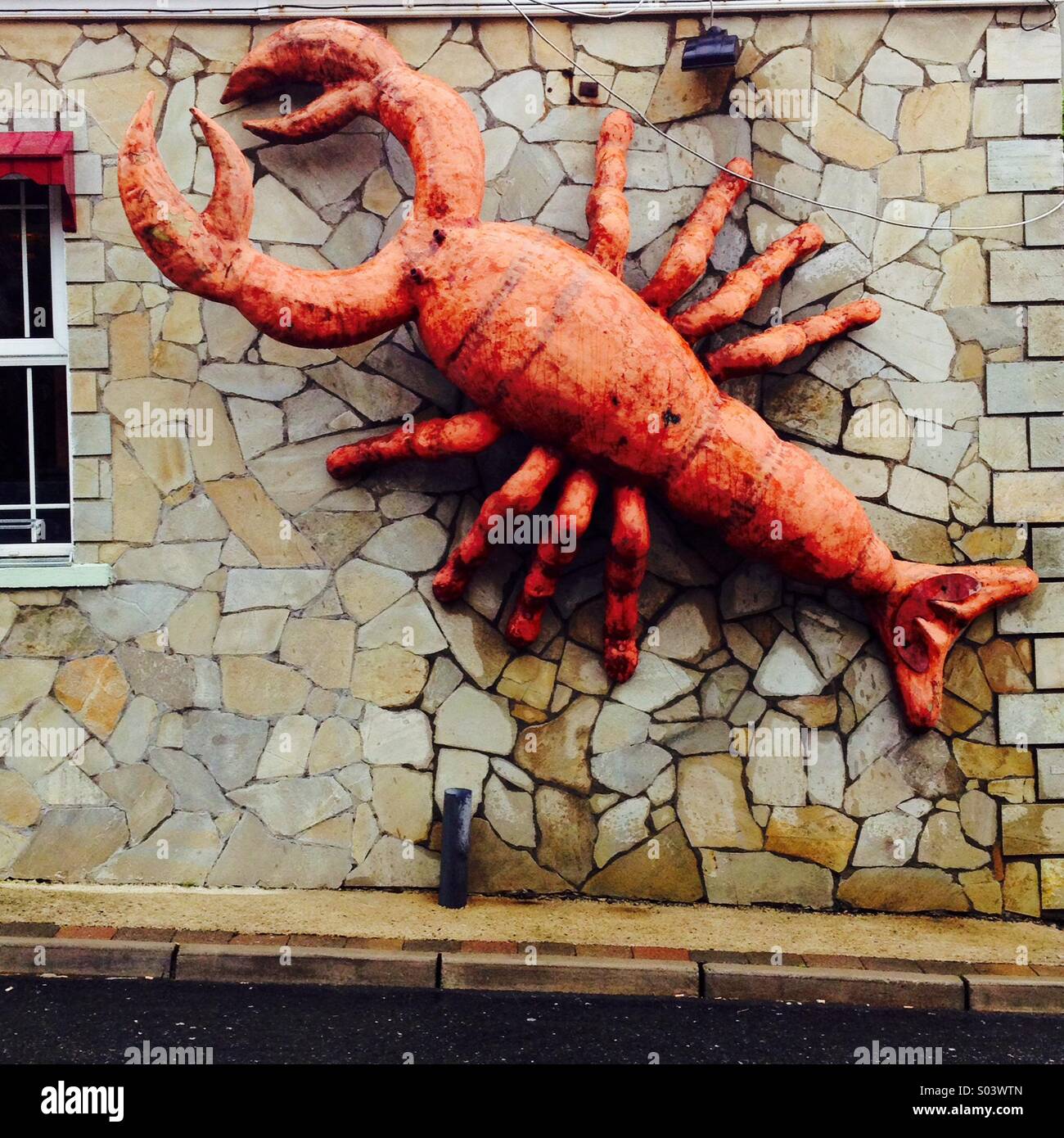 Giant lobster outside seafood restaurant - Smartphone Captured Stock Image