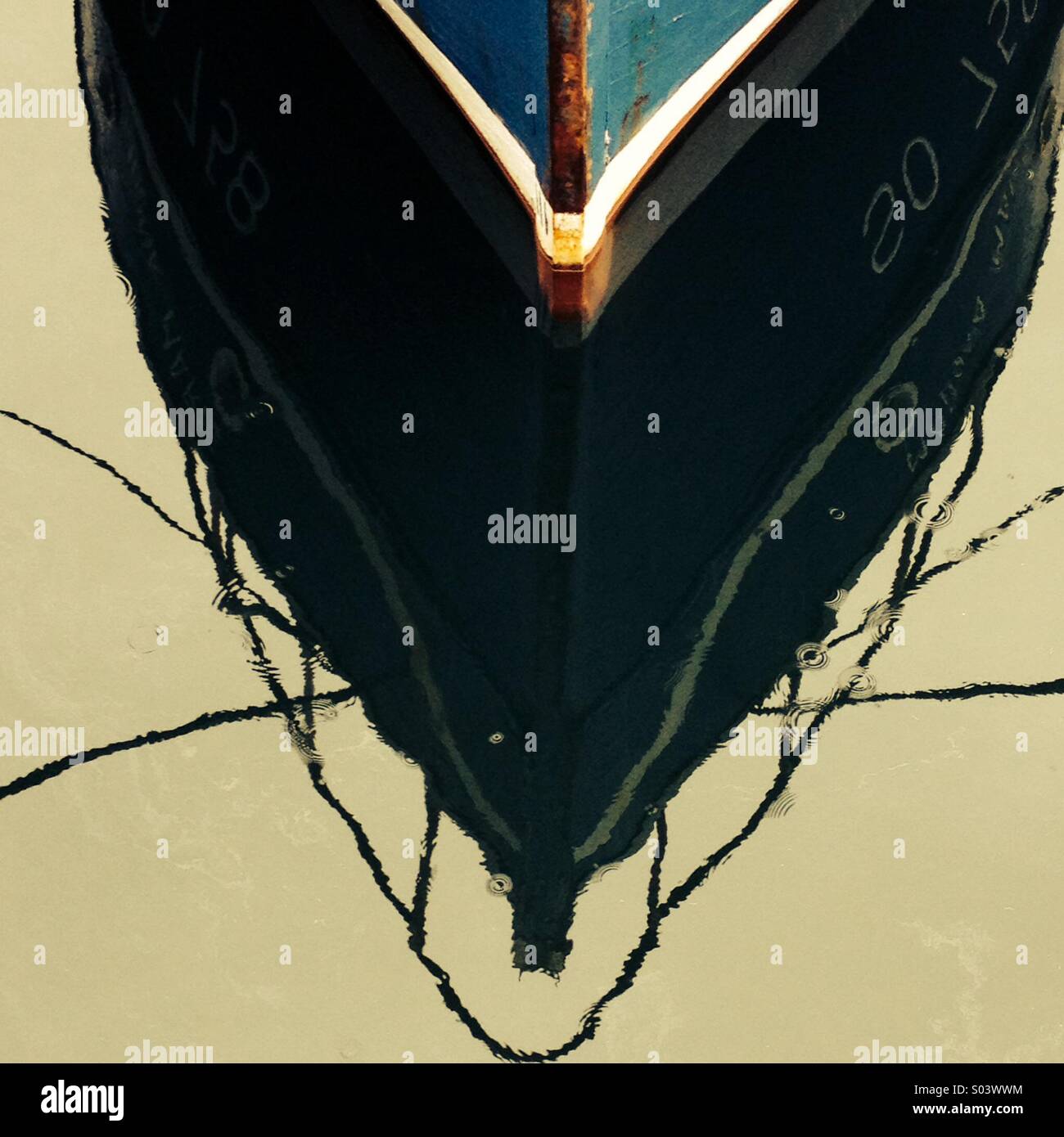 Reflections of moored fishing boat - Smartphone Captured Stock Image