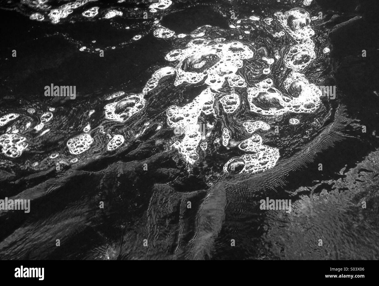 Frothing foaming river at how Stean North Yorkshire Stock Photo