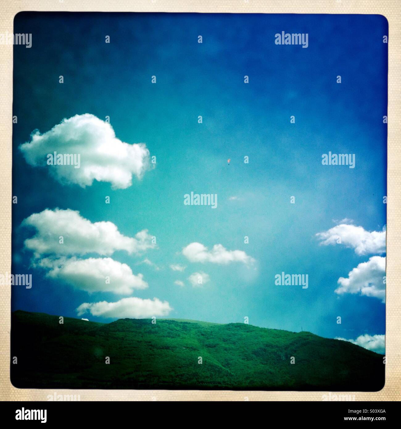 Mount Subasio in Umbria, Italy, with blue sky and white clouds - Smartphone Captured Stock Image