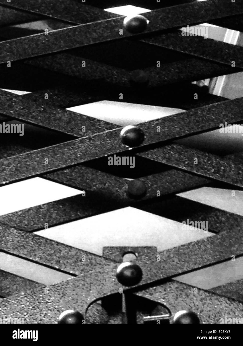 Industrial scissor lift closeup black and white Stock Photo