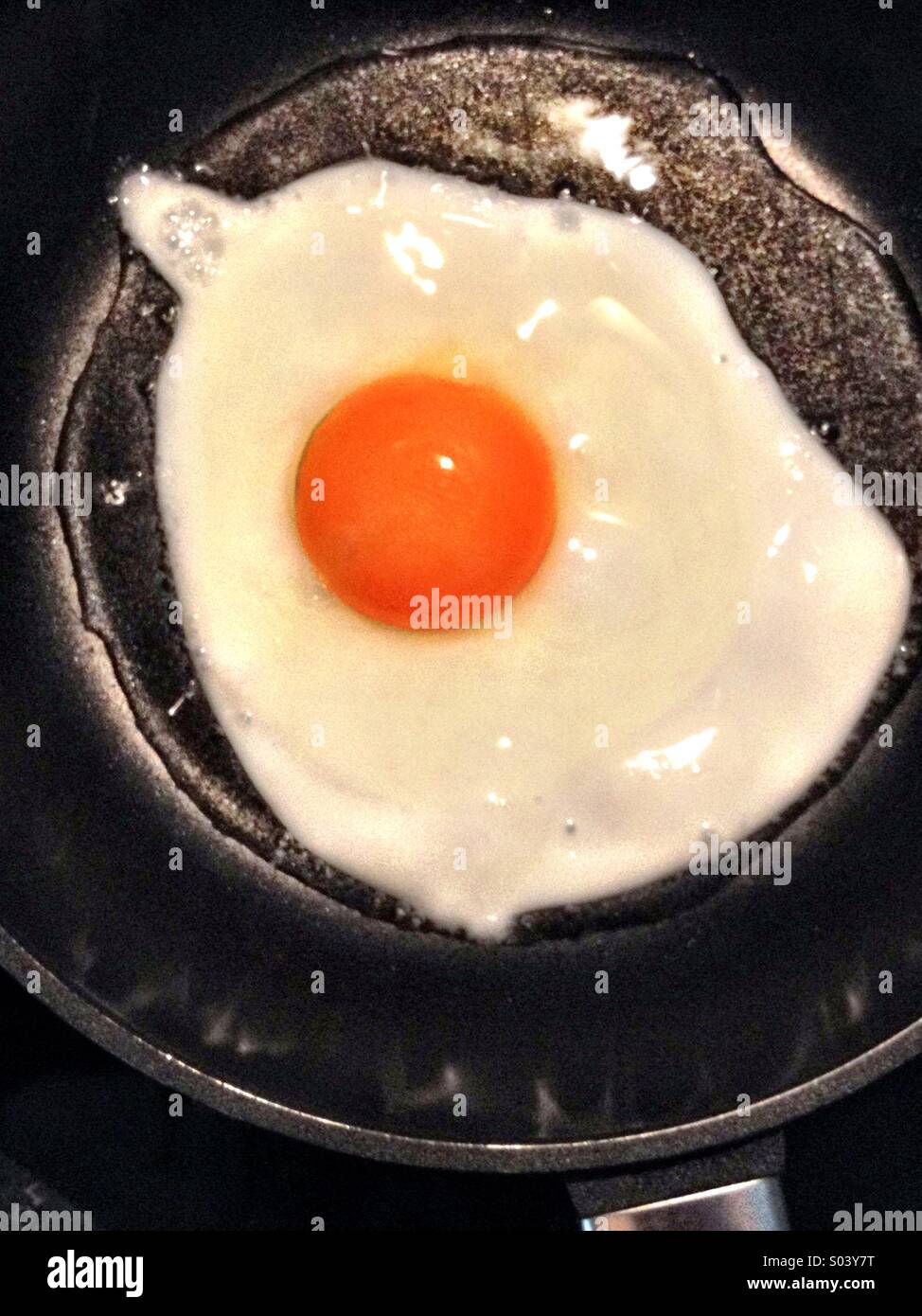 Frying an egg - Smartphone Captured Stock Image