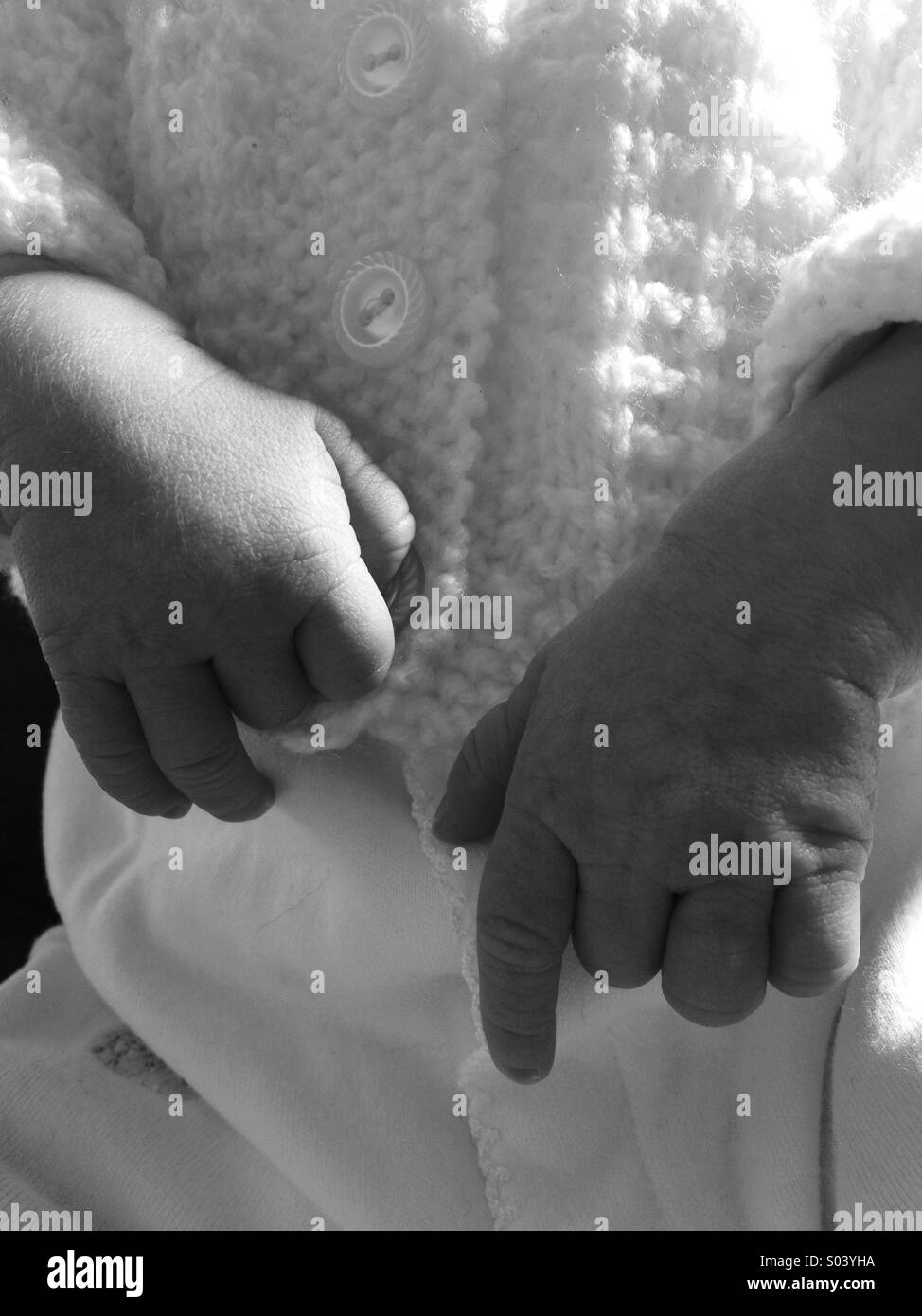 Hands of a new born baby Stock Photo