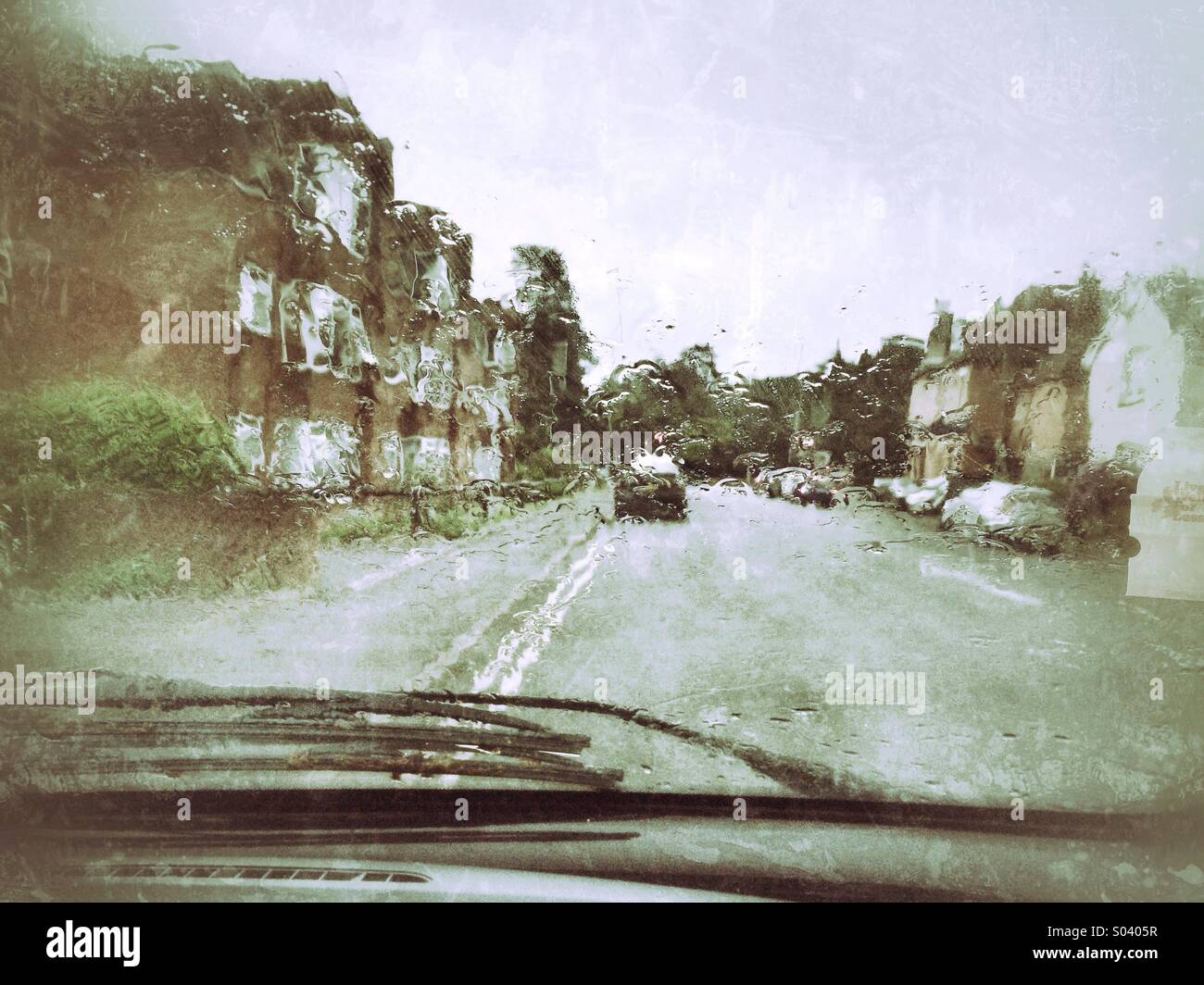 Street scene with cars on wet rainy day Stock Photo - Alamy