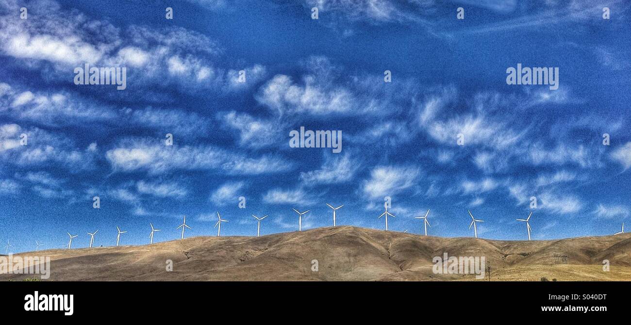 Driving by a wind farm in the country Stock Photo