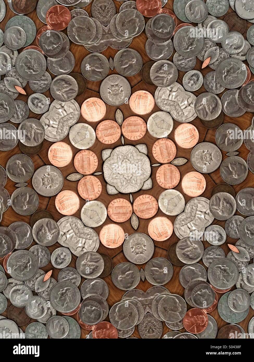 A kaleidoscope image made from coins - quarters, dimes, nickels, pennies - Smartphone Captured Stock Image