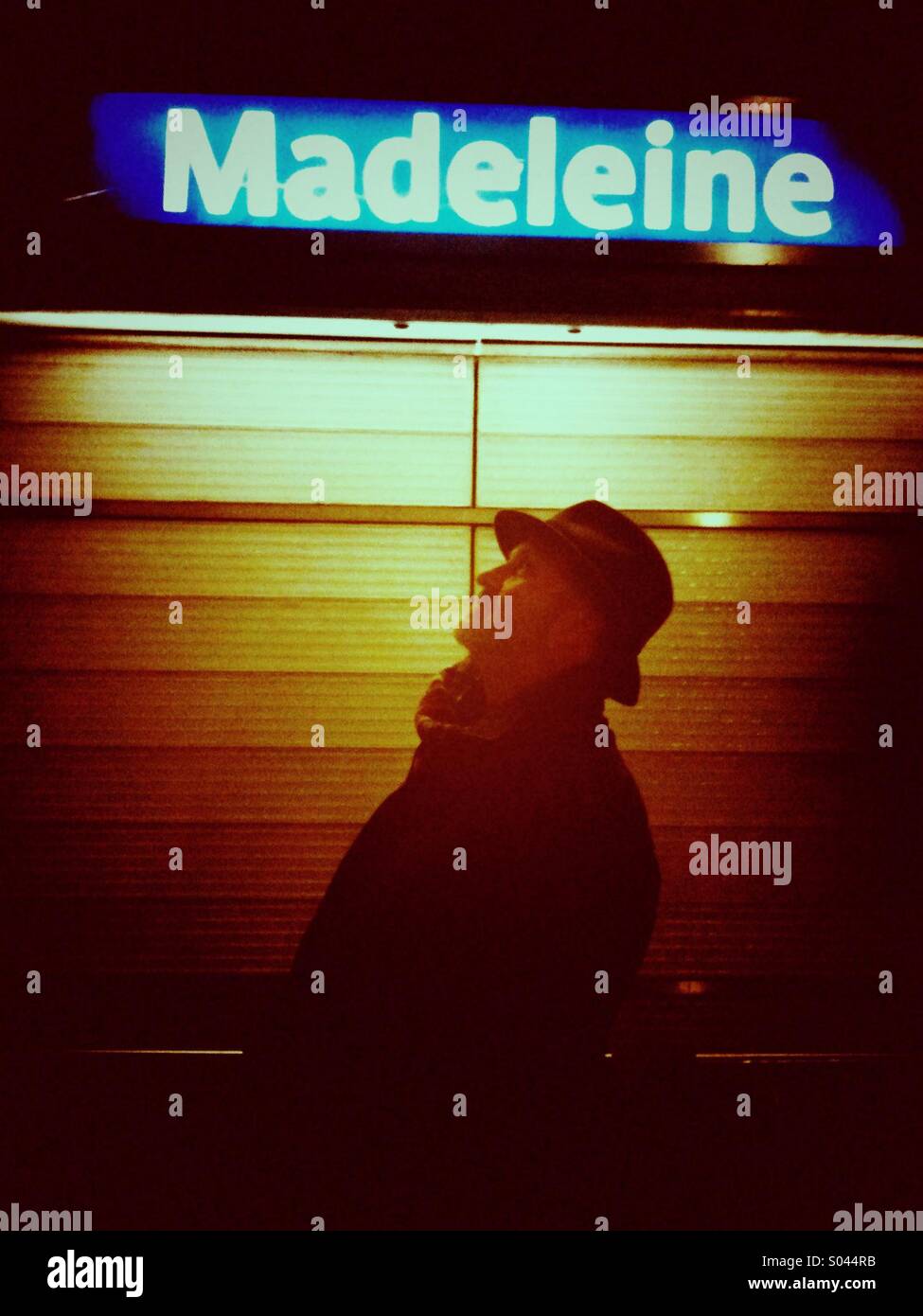 Man waiting at the Madeleine metro station in Paris - Smartphone Captured Stock Image