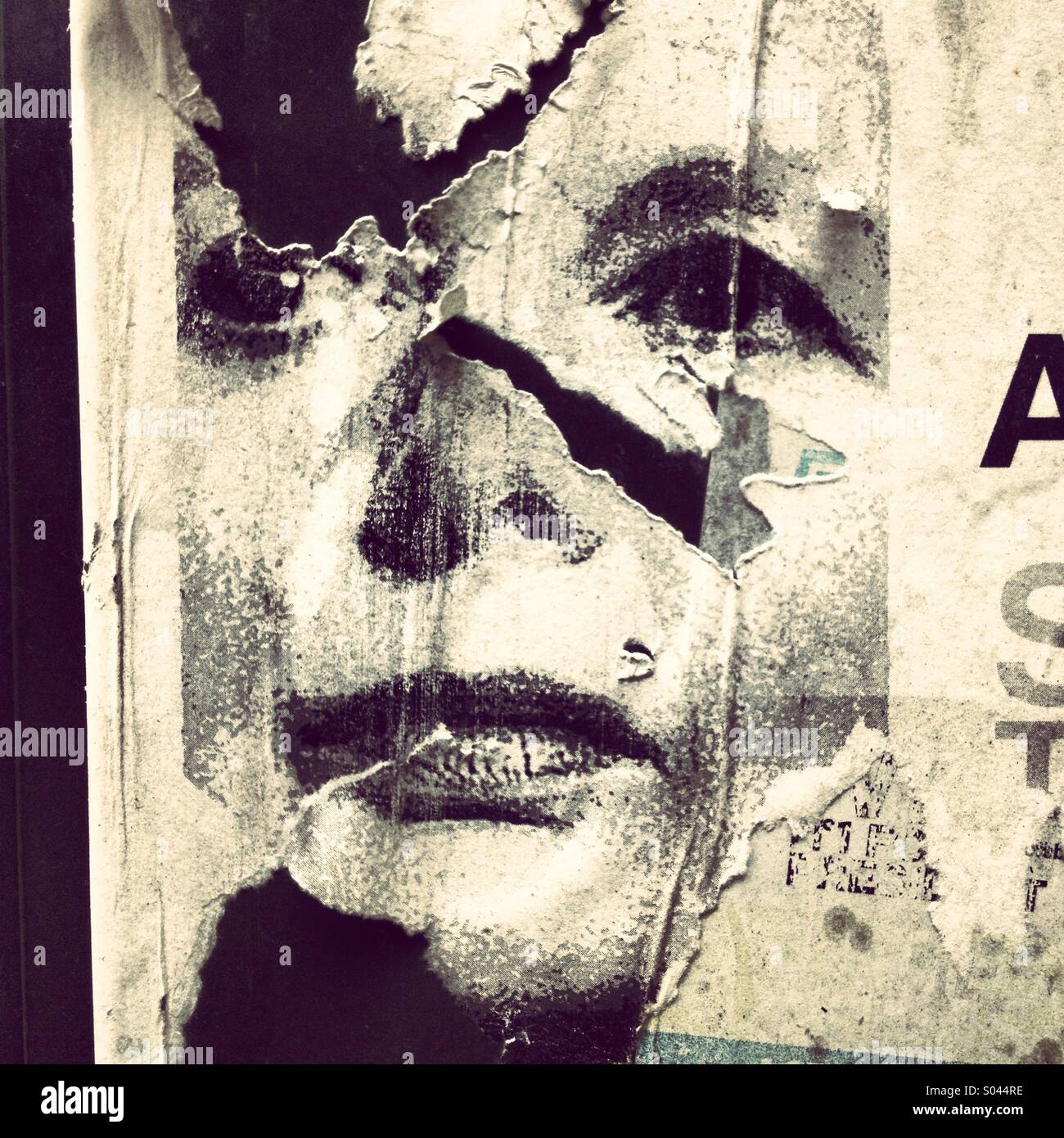 Torn poster depicting the face of British politician Margaret Thatcher. Stock Photo