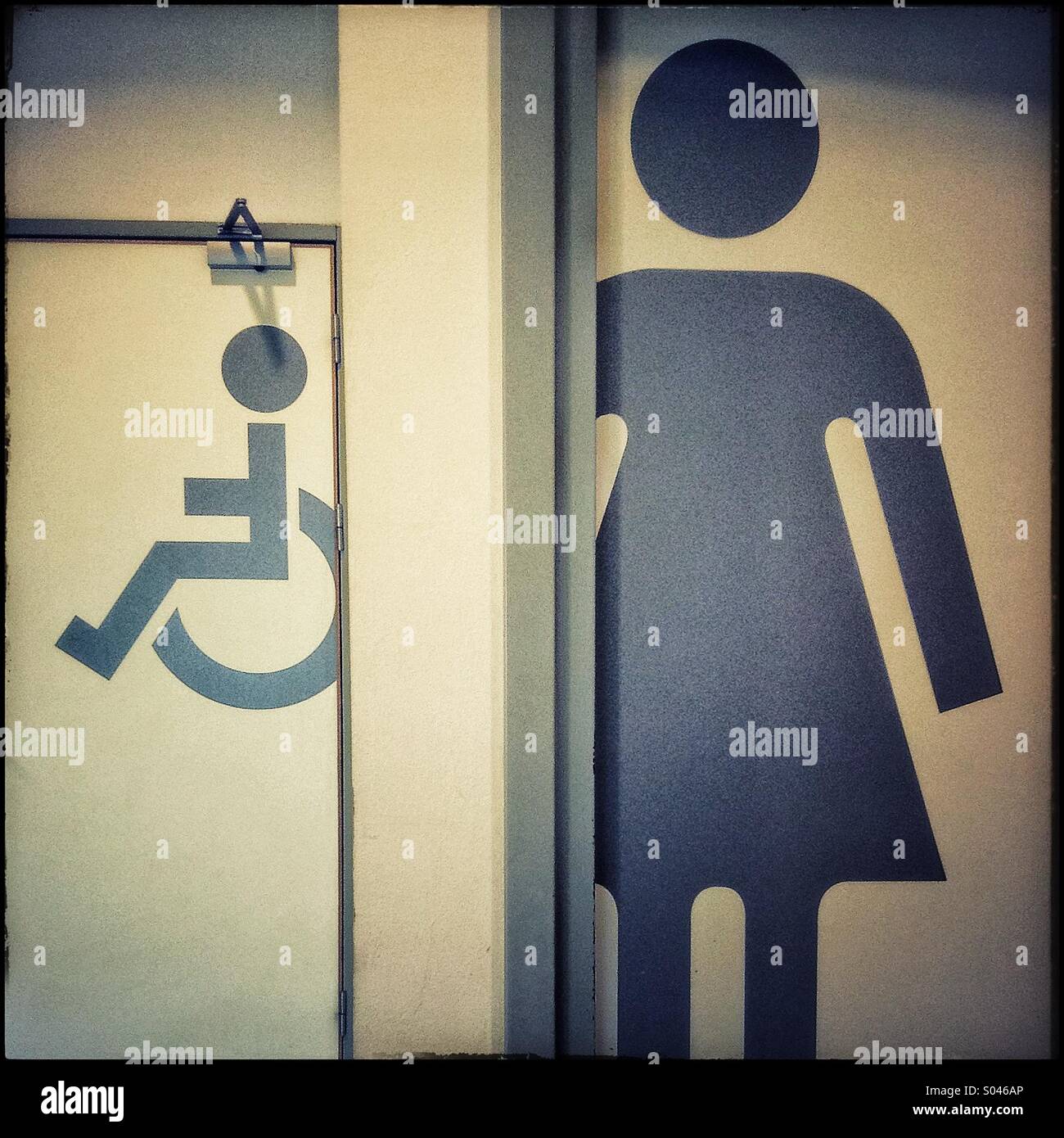 Women and disabled toilet signs Stock Photo