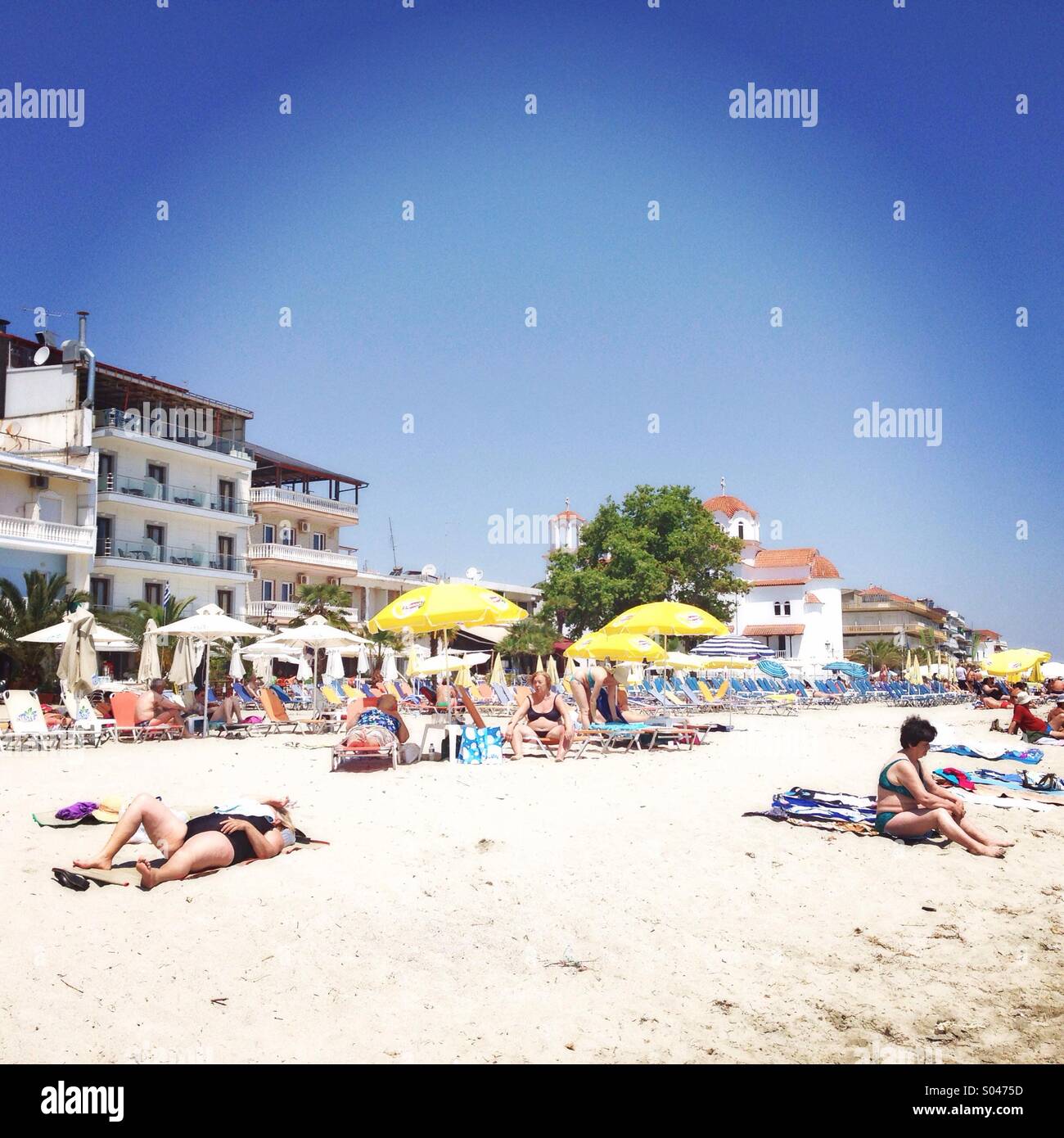 Sun bathing and relax on beach, Paralia, Katerini, Greece Stock Photo ...
