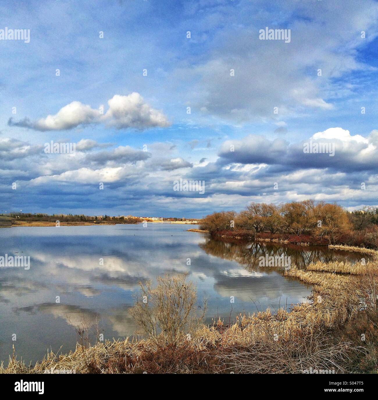 Clouds reflection on wascana lake Stock Photo