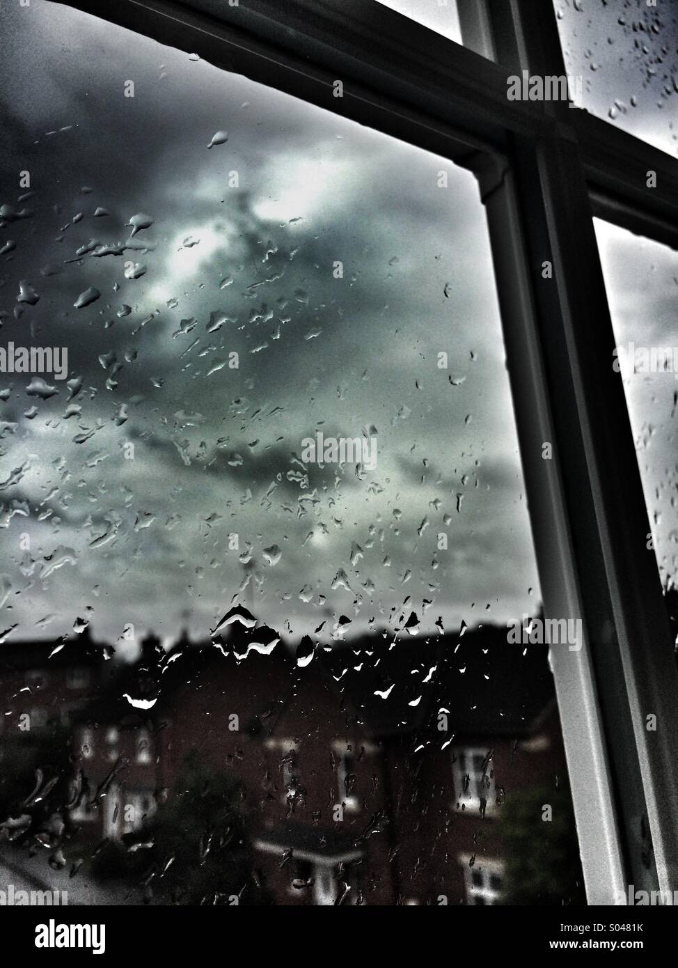 Looking out the window on a dark stormy rainy day - Smartphone Captured Stock Image