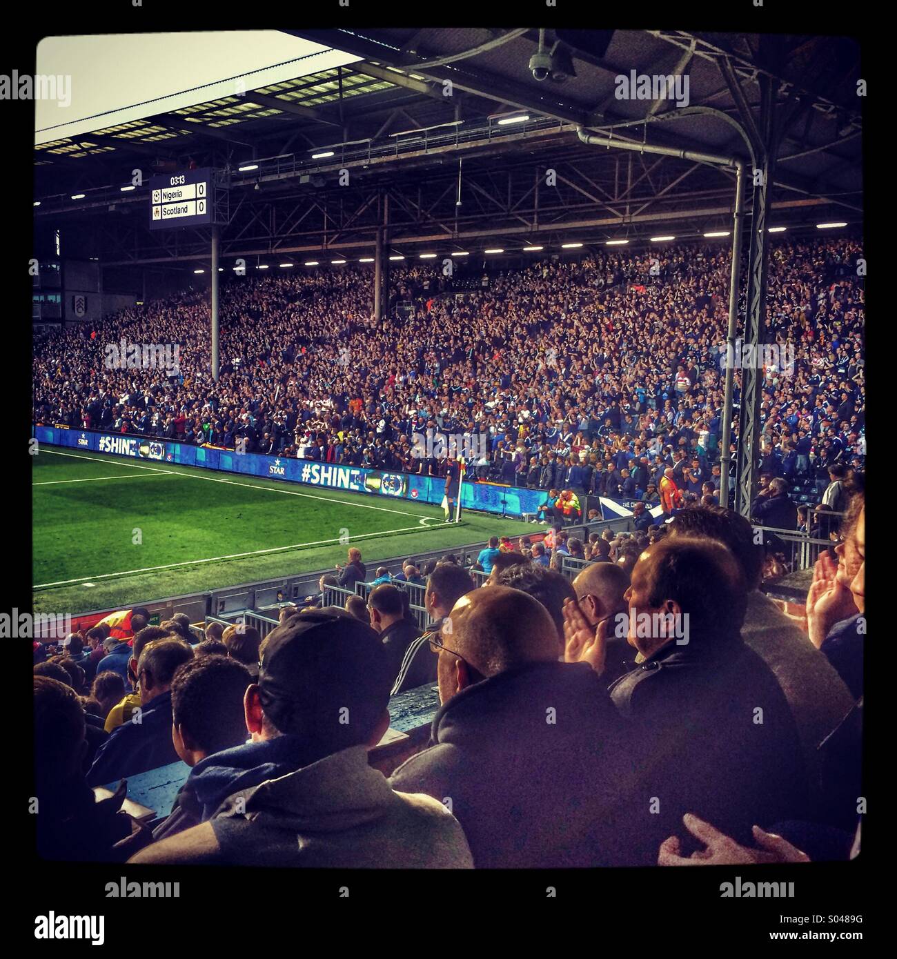Football fans in a stadium Stock Photo Alamy
