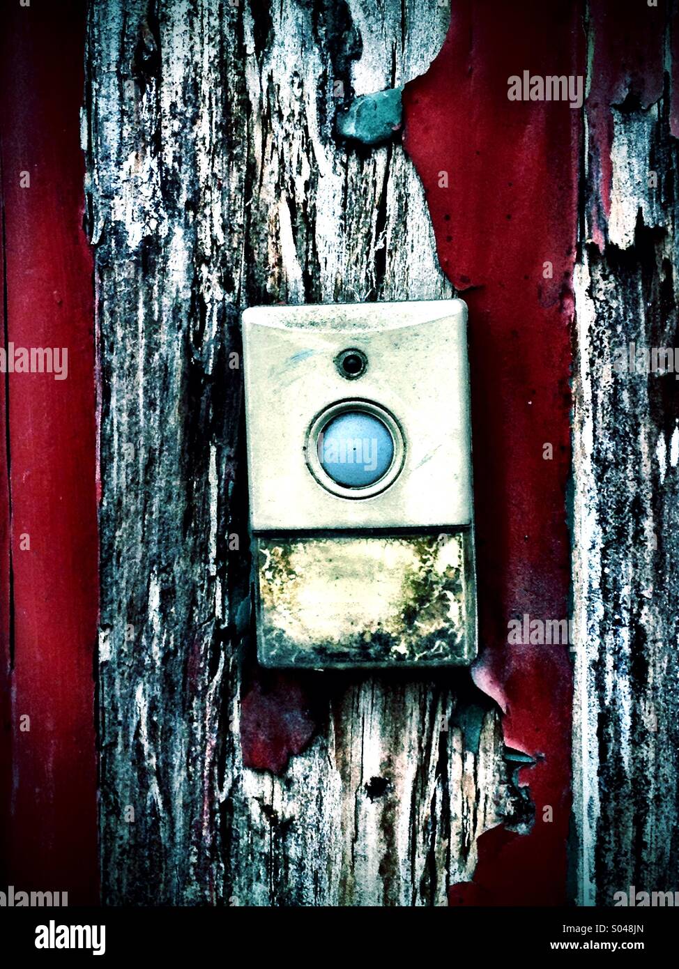 Bell push on worn door - Smartphone Captured Stock Image