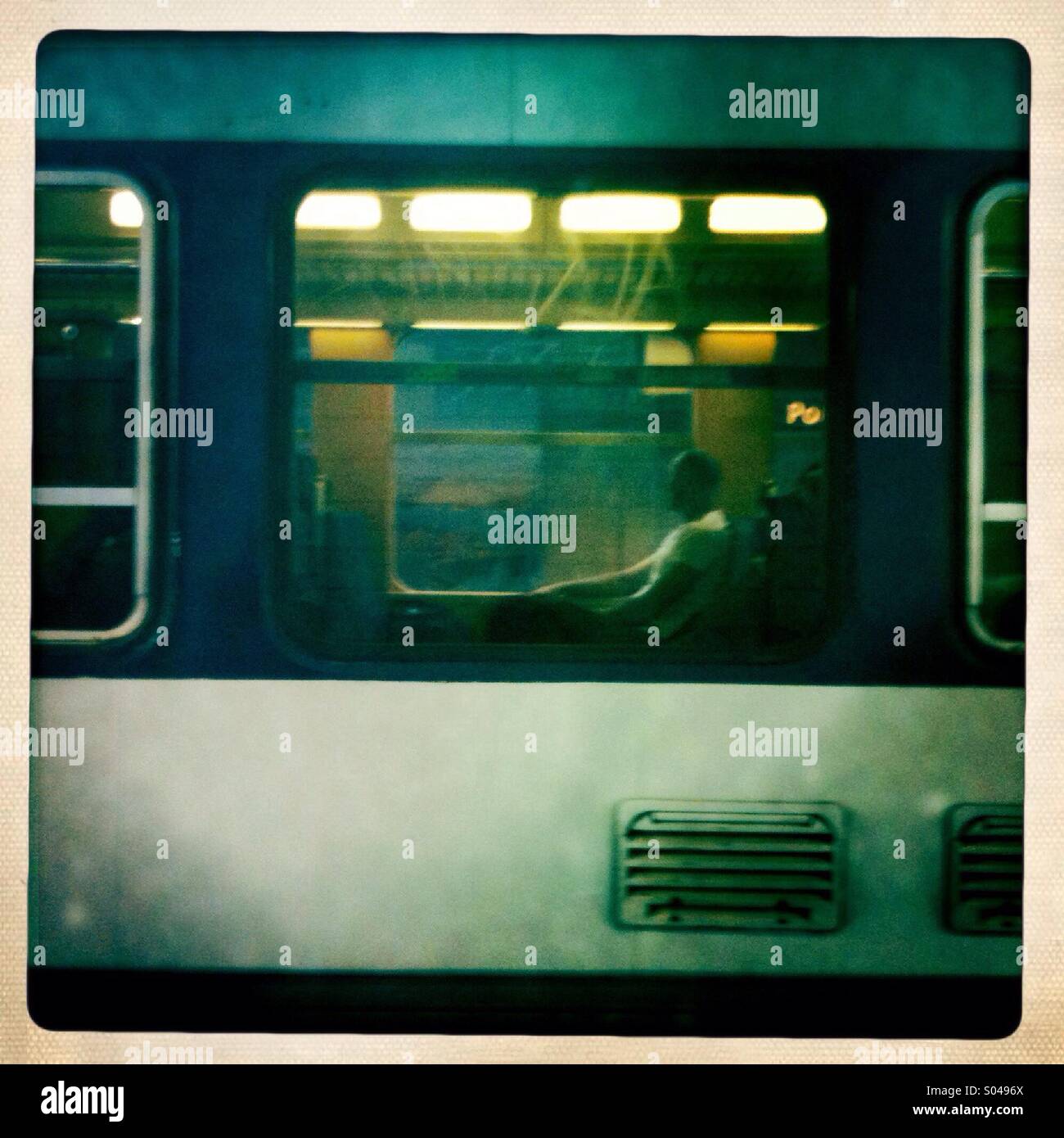 Man in the window of a train car - Smartphone Captured Stock Image