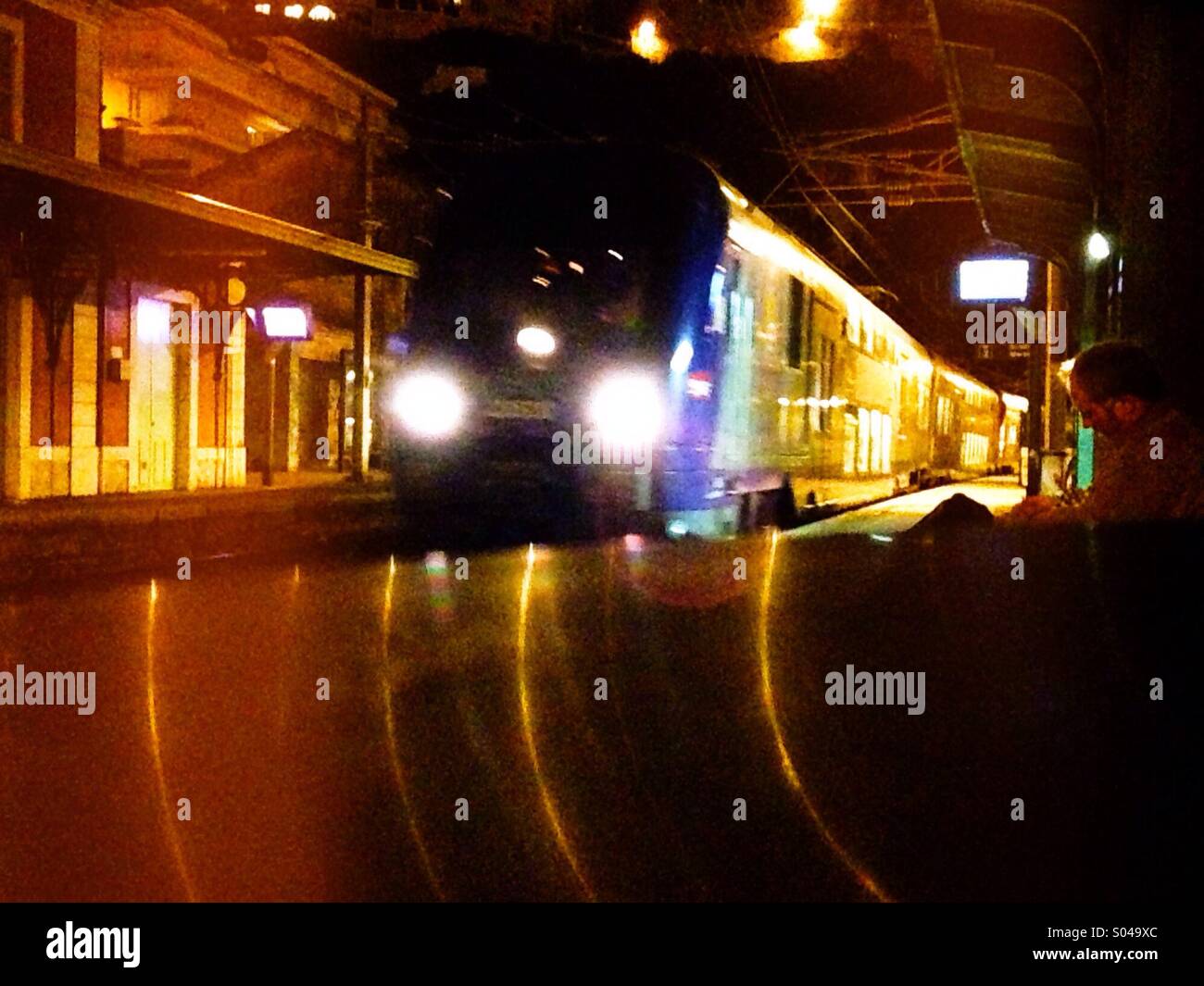 Night train arriving in a train station - Smartphone Captured Stock Image