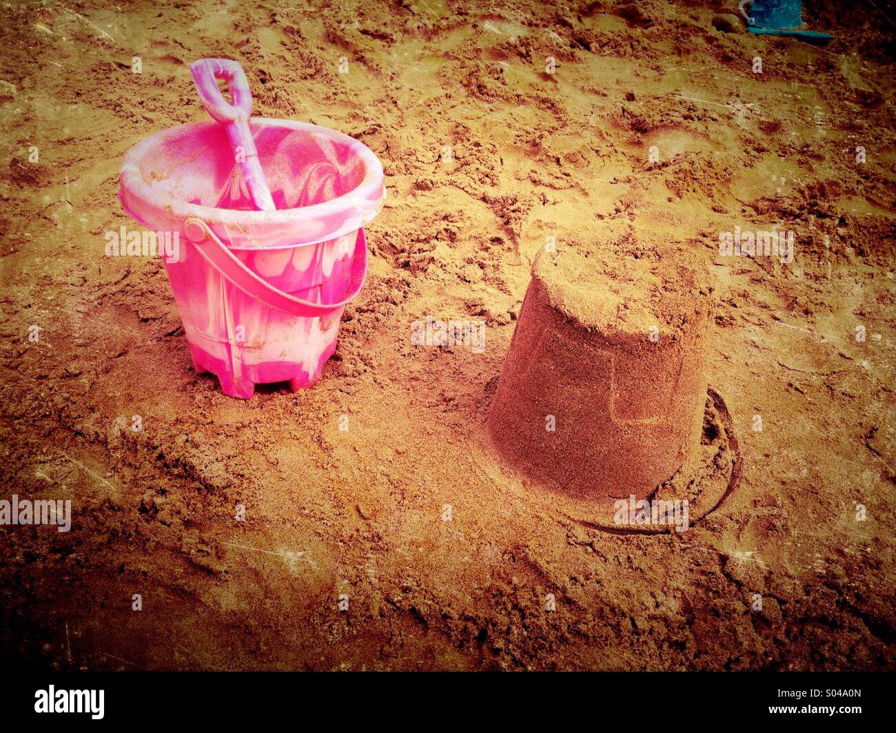 Sandcastle and bucket and spade Stock Photo