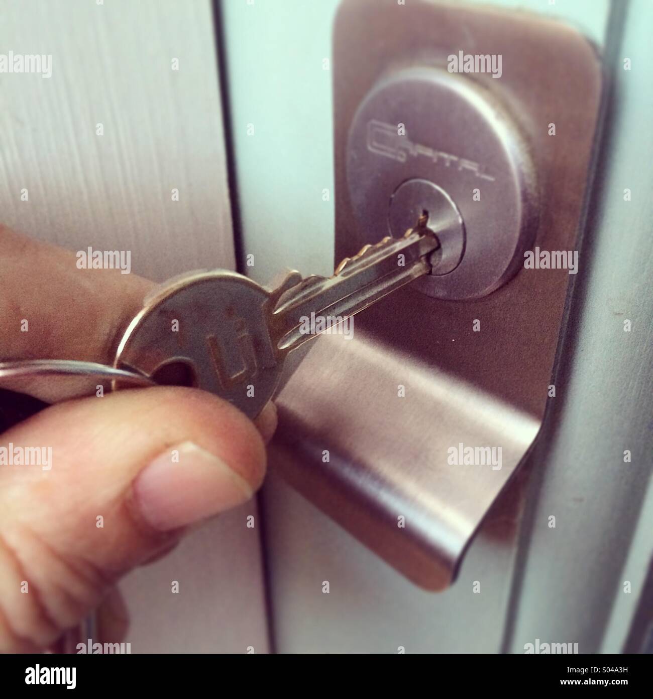 Key going into a lock - Smartphone Captured Stock Image