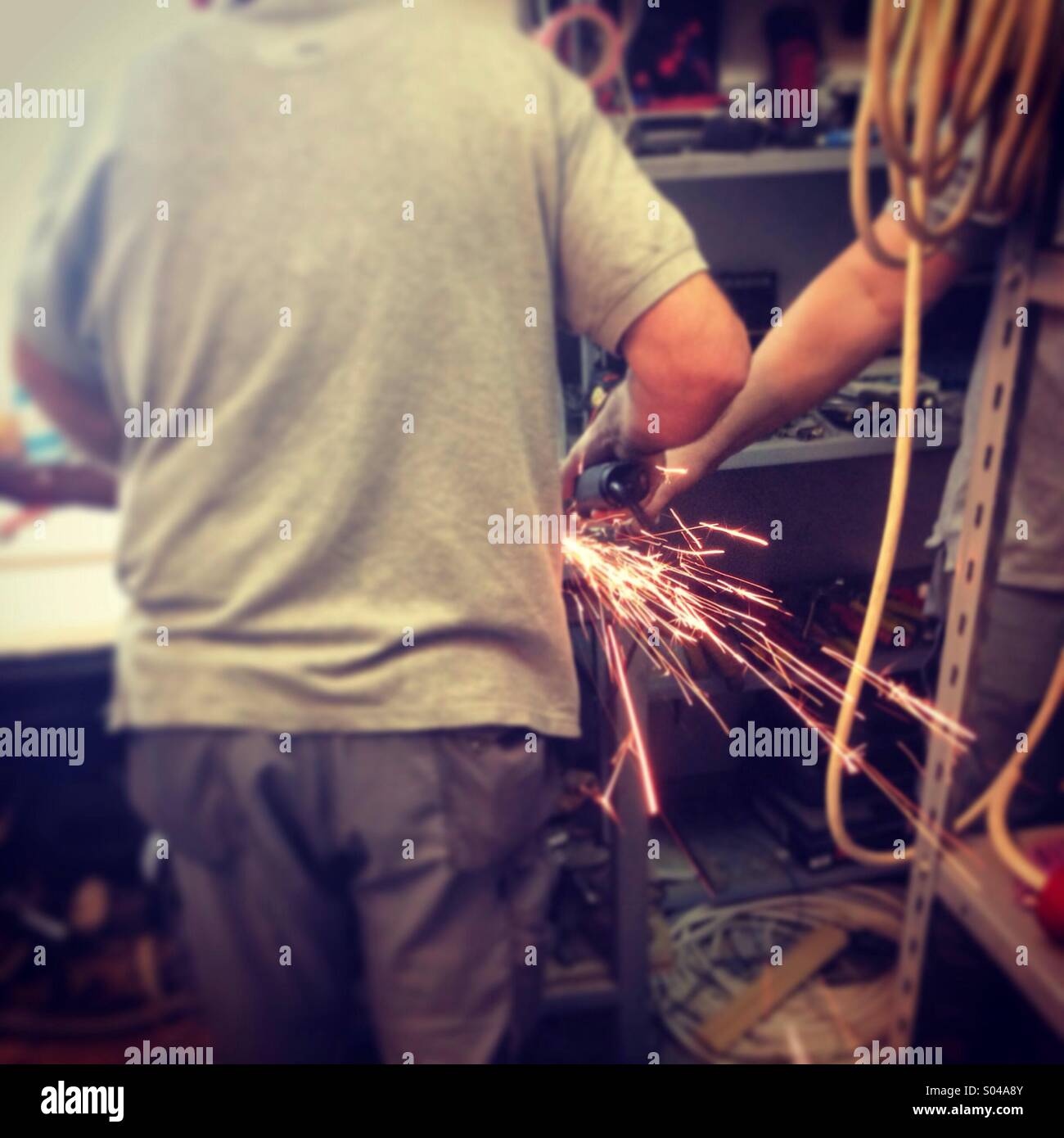 Man working with grinder Stock Photo Alamy