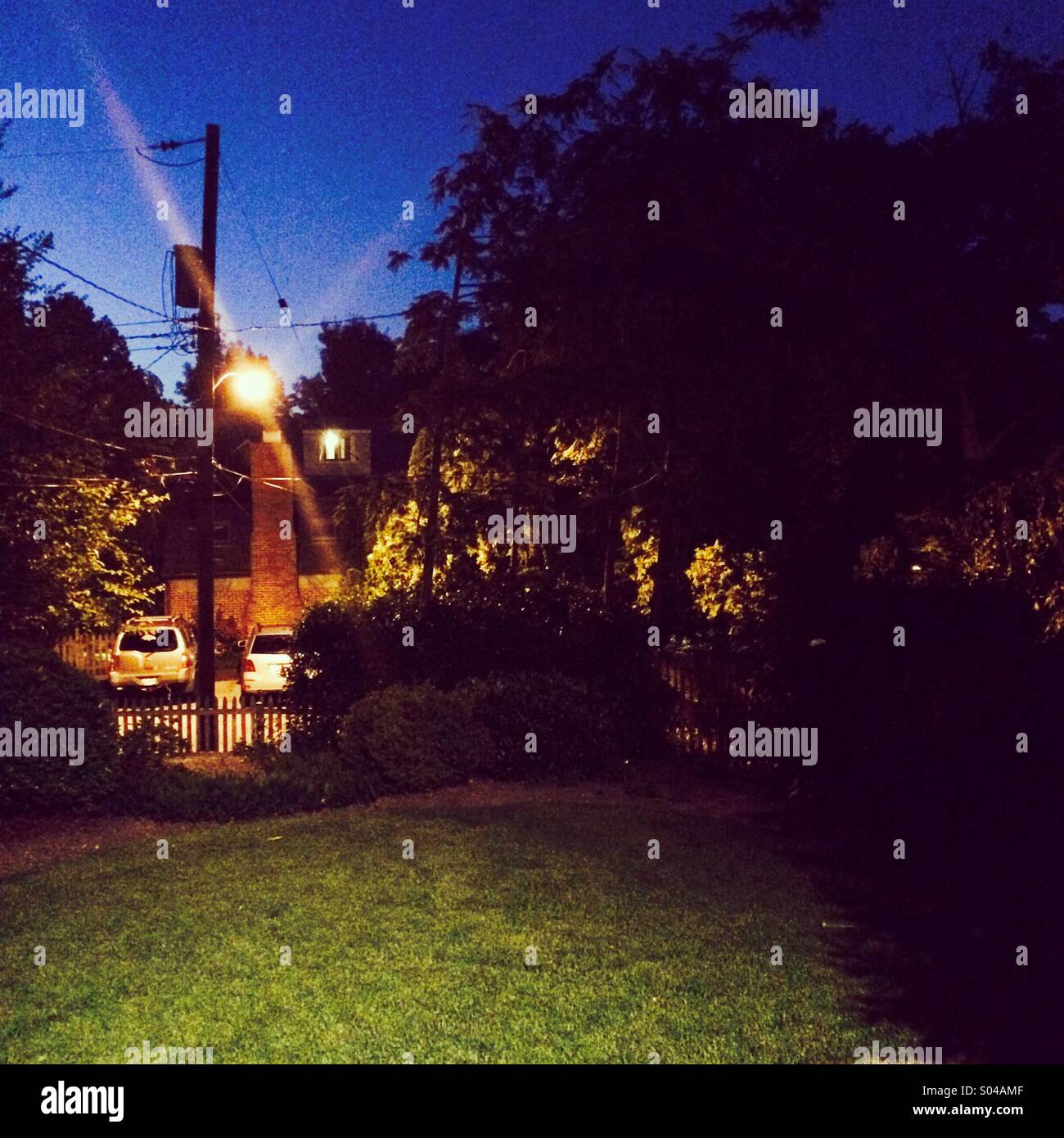 A backyard in Baltimore, Maryland at twilight. - Smartphone Captured Stock Image