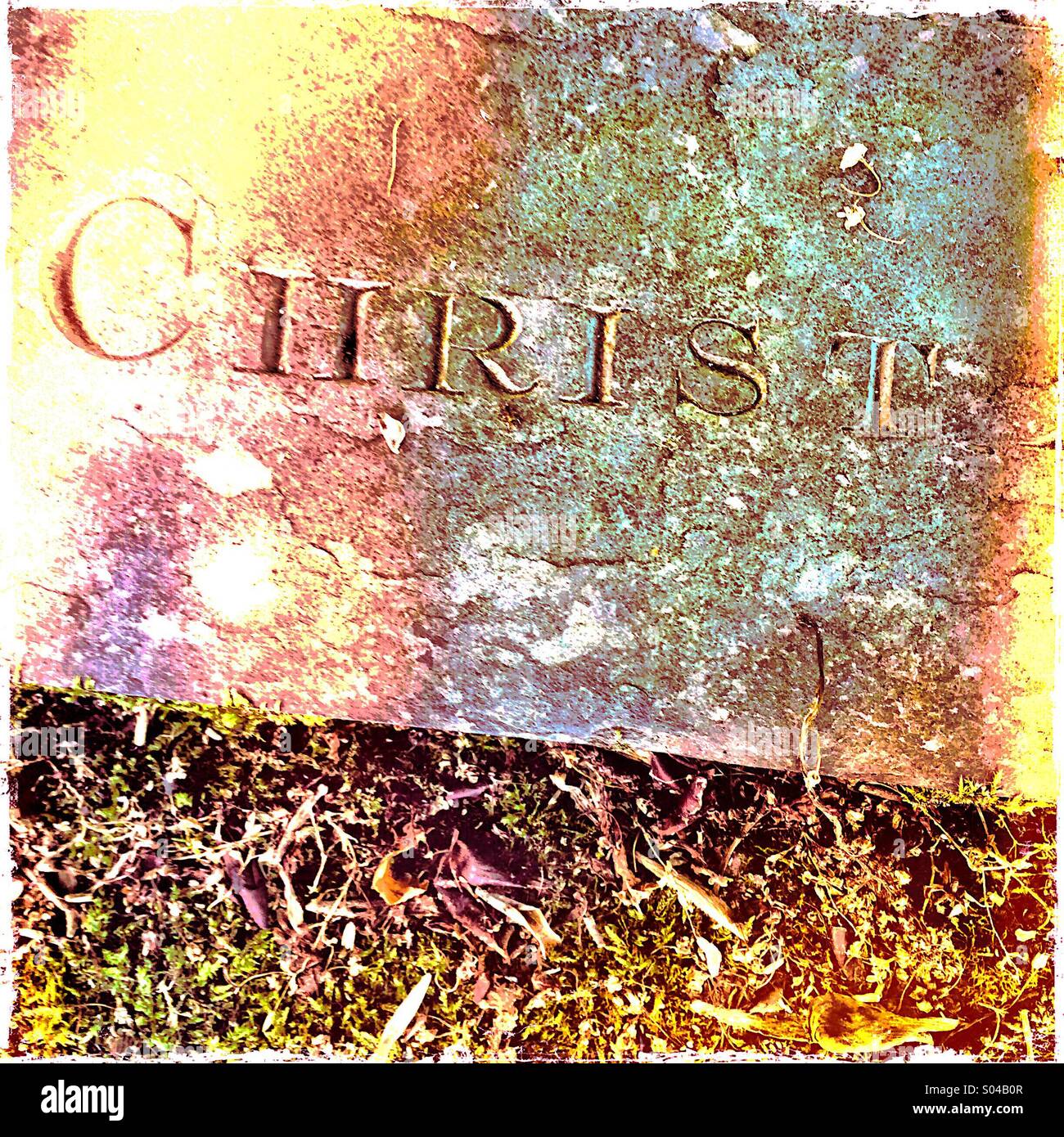 Christ carved on old gravestone - Smartphone Captured Stock Image