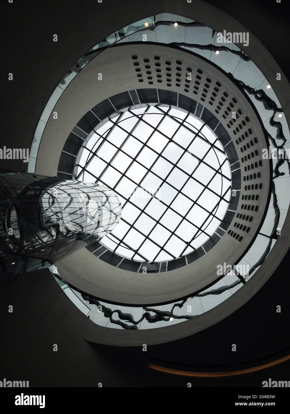 Glass interior roof and lift of The Library of Birmingham, England, UK - Smartphone Captured Stock Image