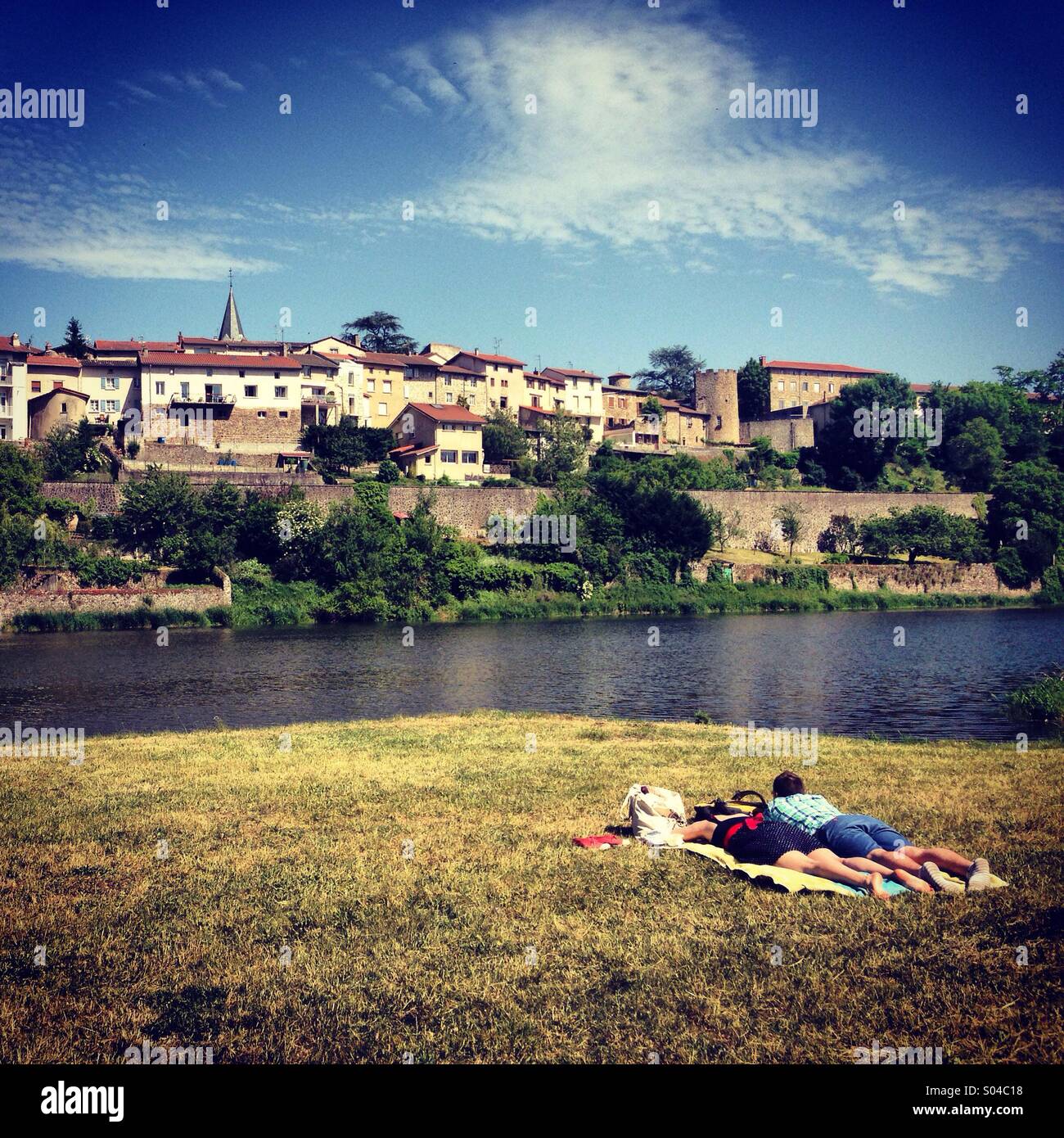 Couple relaxing near river Loire, France - Smartphone Captured Stock Image