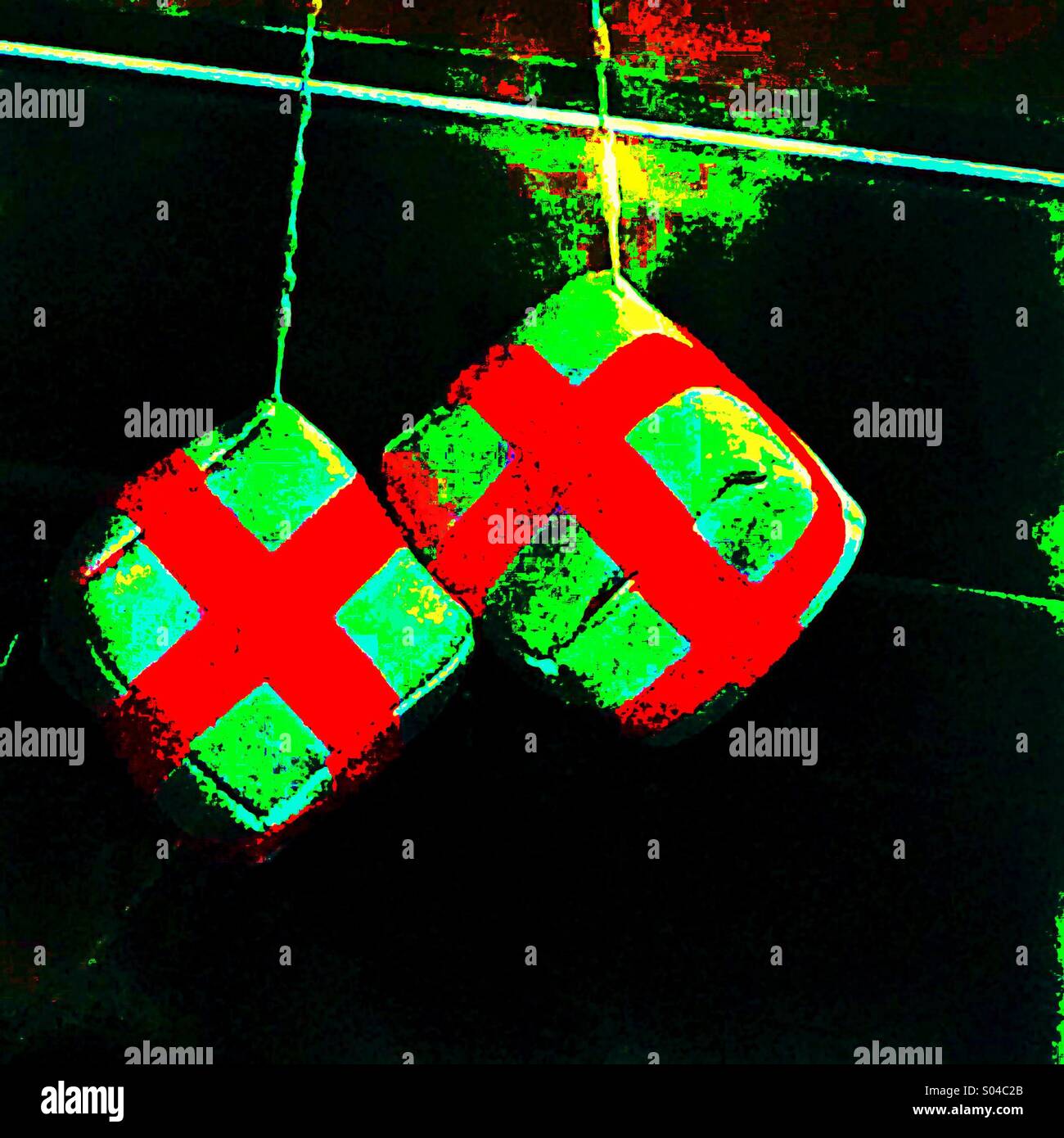 Pair of cross of St George dice hanging in car window - Smartphone Captured Stock Image